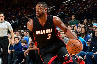 NEW YORK, NY - NOVEMBER 30:  Dwyane Wade #3 of the Miami Heat drives to the basket against the New York Knicks on November 30, 2014 at Madison Square Garden in New York City.  NOTE TO USER: User expressly acknowledges and agrees that, by downloading and o