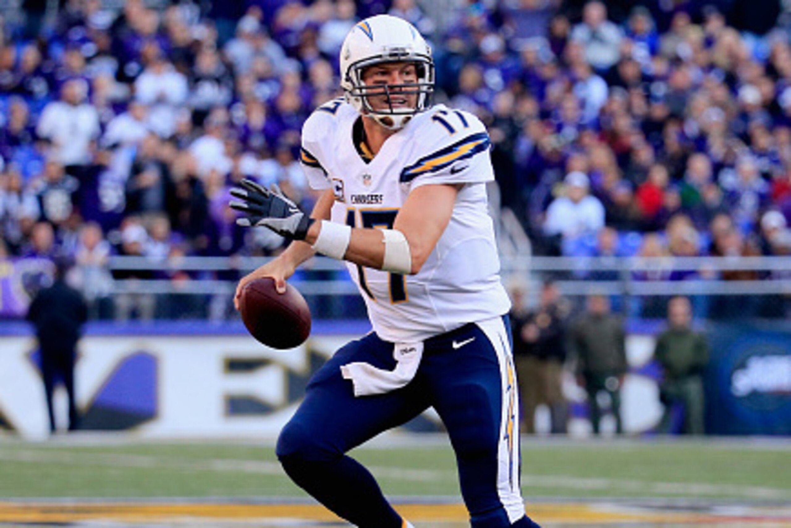 BALTIMORE, MD - NOVEMBER 30: Quarterback Philip Rivers #17 of the San Diego Chargers scrambles during the third quarter of a game against the Baltimore Ravens at M&T Bank Stadium on November 30, 2014 in Baltimore, Maryland.  (Photo by Rob Carr/Getty Image
