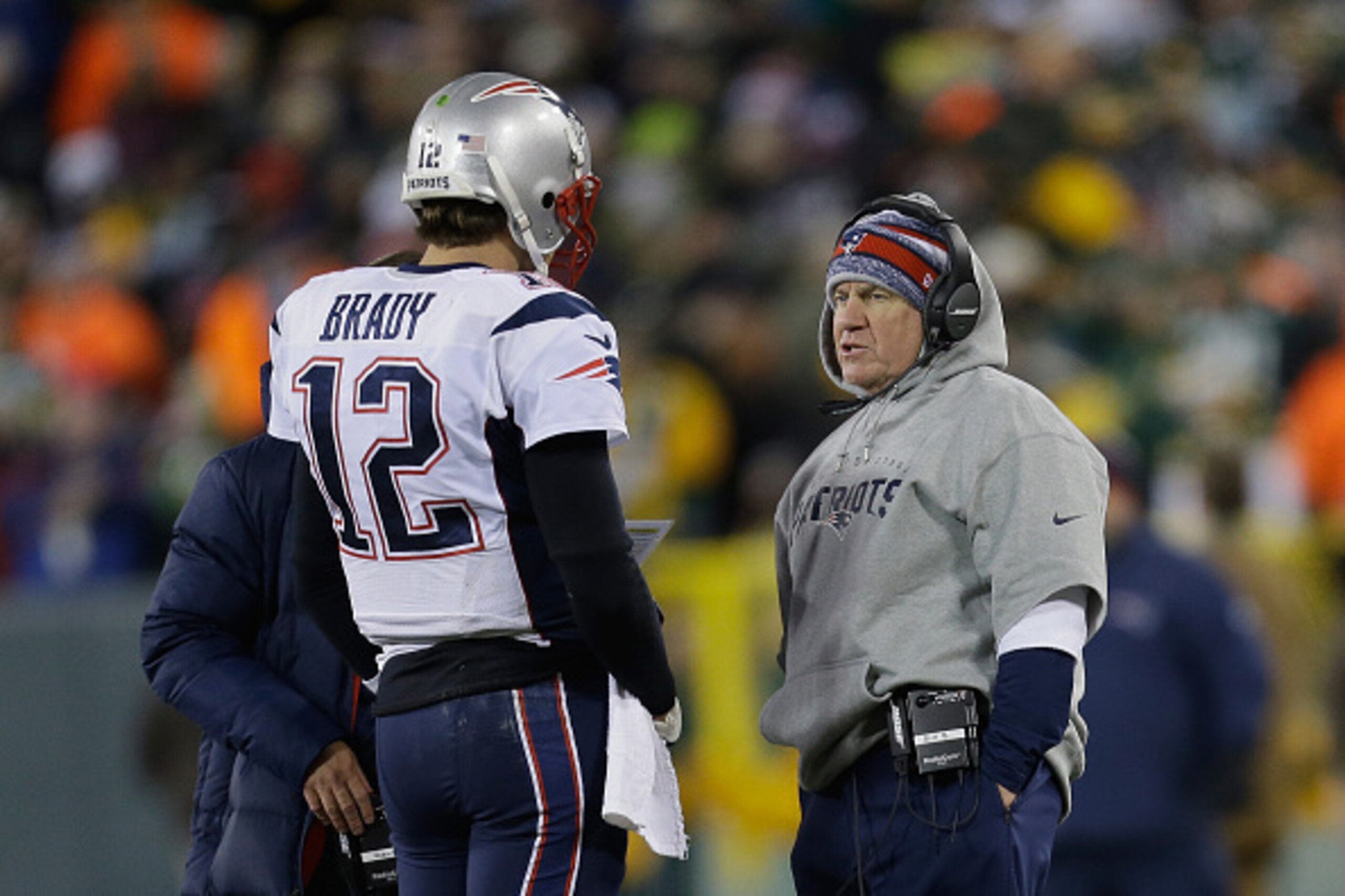 GREEN BAY, WI - NOVEMBER 30:  Quarterback Tom Brady #12 of the New England Patriots talks with head coach Bill Belichick in the second quarter during the NFL game against the Green Bay Packers at Lambeau Field on November 30, 2014 in Green Bay, Wisconsin.