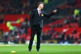 MANCHESTER, ENGLAND - NOVEMBER 29:  Louis van Gaal manager of Manchester United signals prior to the Barclays Premier League match between Manchester United and Hull City at Old Trafford on November 29, 2014 in Manchester, England.  (Photo by Clive Mason/
