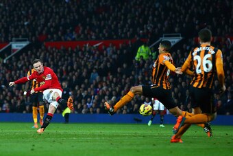 MANCHESTER, ENGLAND - NOVEMBER 29:  Wayne Rooney of Manchester United scores their second goal during the Barclays Premier League match between Manchester United and Hull City at Old Trafford on November 29, 2014 in Manchester, England.  (Photo by Matthew