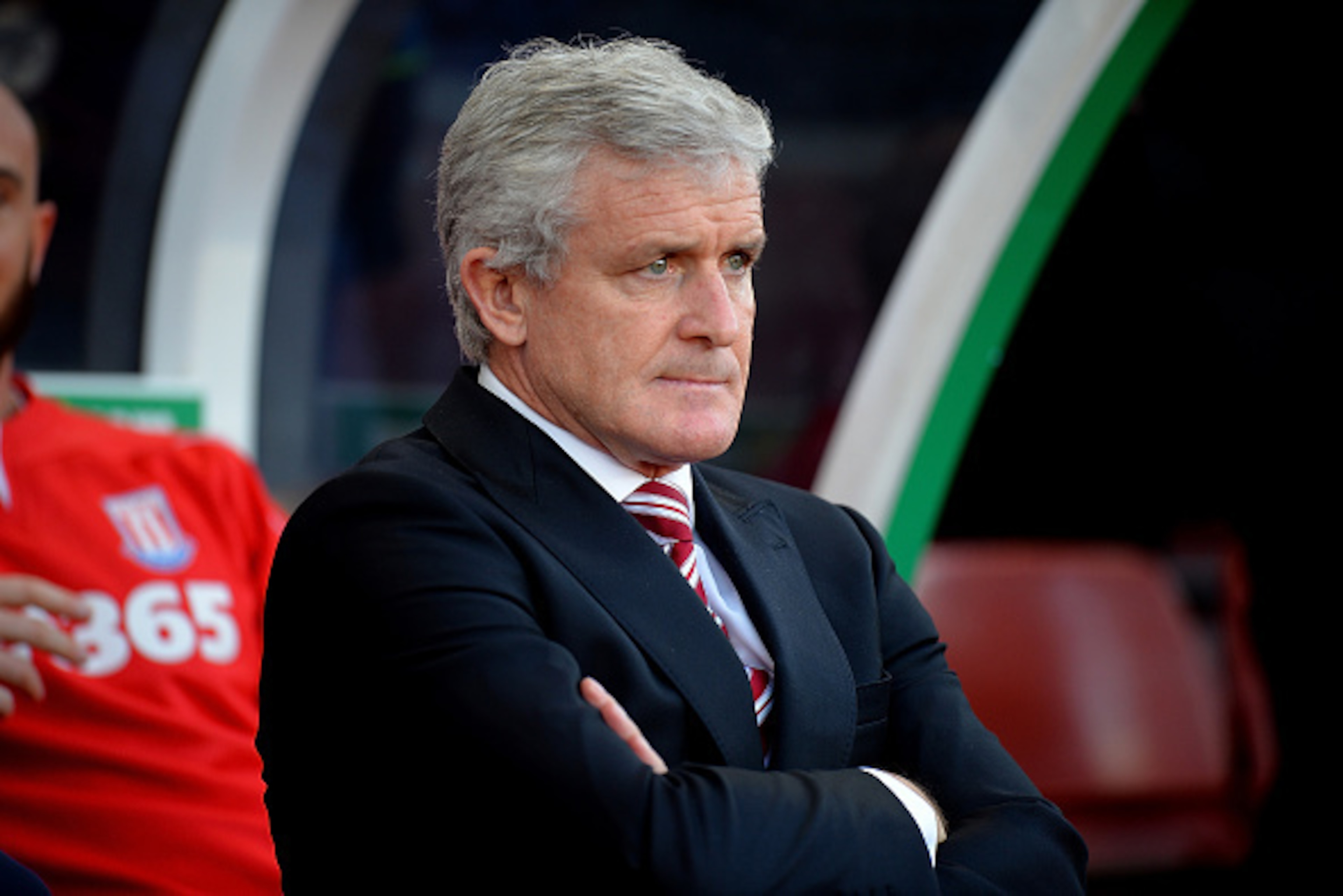 STOKE ON TRENT, ENGLAND - NOVEMBER 22: Stoke City Manager Mark Hughes looks on prior to the Barclays Premier League match between Stoke City and Burnley at the Britannia Stadium on November 22, 2014 in Stoke on Trent, England. (Photo by Tony Marshall/Ge STOKE ON TRENT, ENGLAND - NOVEMBER 22: Stoke City Manager Mark Hughes looks on prior to the Barclays Premier League match between Stoke City and Burnley at the Britannia Stadium on November 22, 2014 in Stoke on Trent, England. (Photo by Tony Marshall/Ge