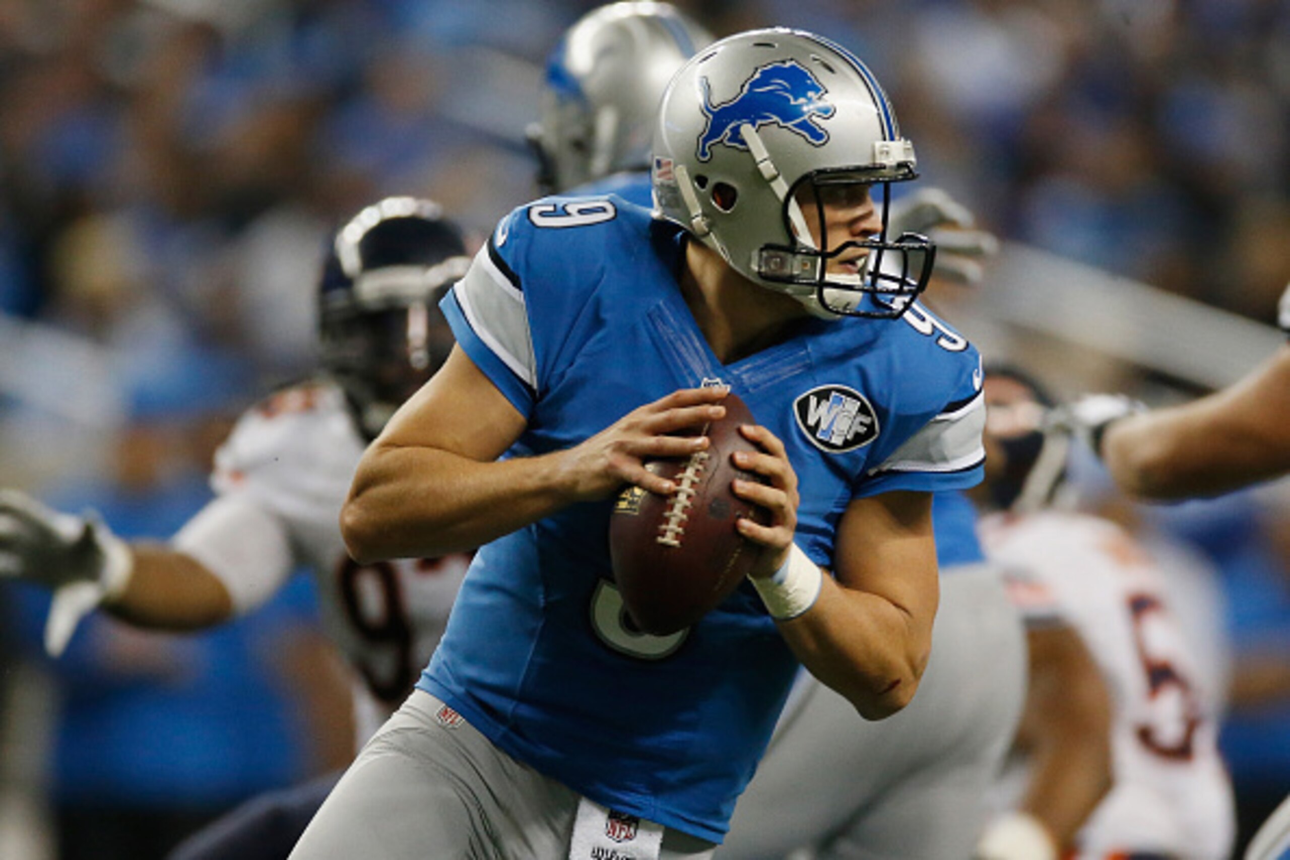 DETROIT, MI - NOVEMBER 27: Matthew Stafford #9 of the Detroit Lions looks to throw a second quarter pass against the Chicago Bears at Ford Field on November 27, 2014 in Detroit, Michigan. (Photo by Gregory Shamus/Getty Images)