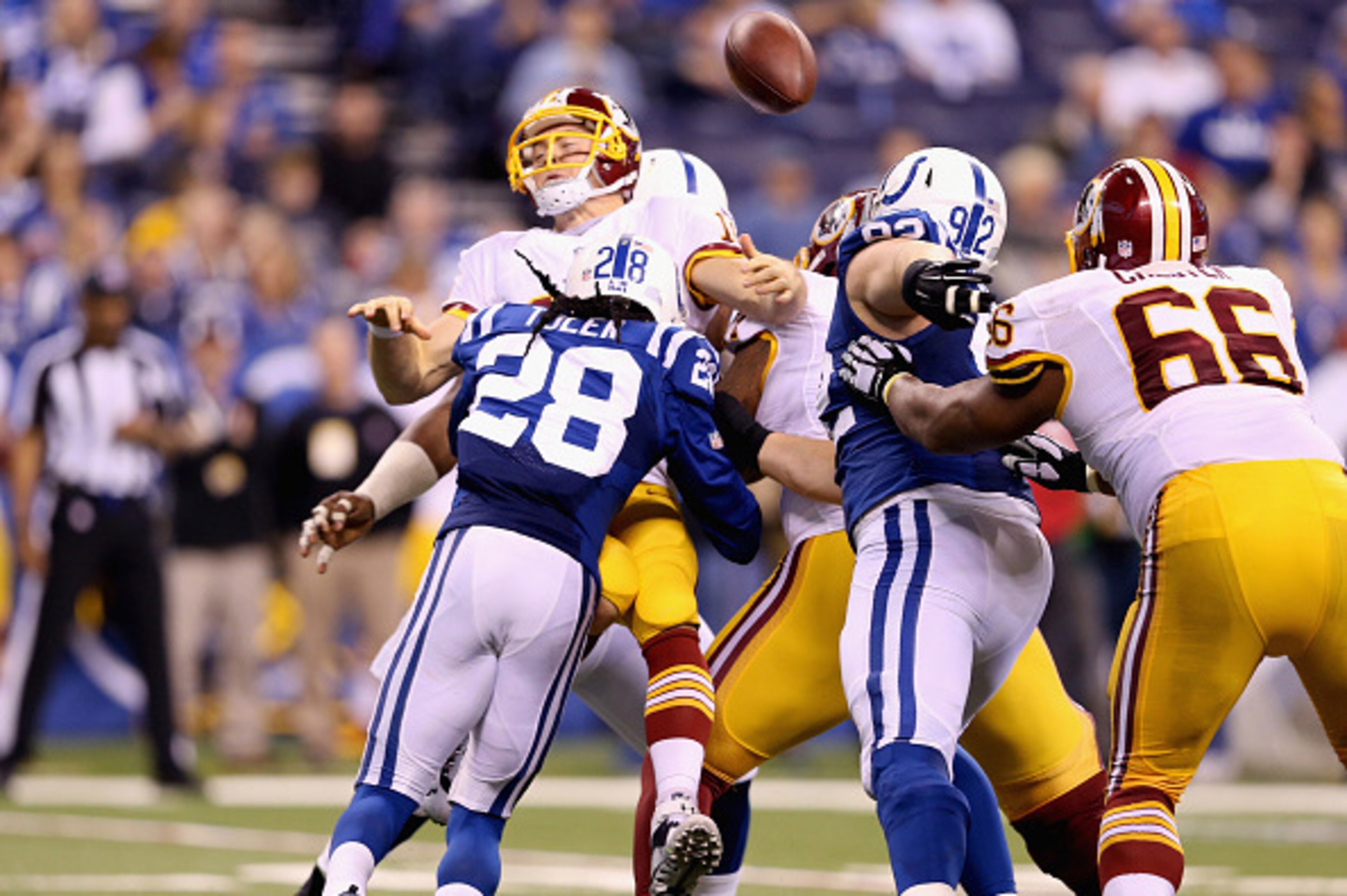 INDIANAPOLIS, IN - NOVEMBER 30: Colt McCoy #16 of the Washington Redskins fumbles the ball after getting sacked during the game against the Indianapolis Colts at Lucas Oil Stadium on November 30, 2014 in Indianapolis, Indiana. (Photo by Andy Lyons/Getty INDIANAPOLIS, IN - NOVEMBER 30: Colt McCoy #16 of the Washington Redskins fumbles the ball after getting sacked during the game against the Indianapolis Colts at Lucas Oil Stadium on November 30, 2014 in Indianapolis, Indiana. (Photo by Andy Lyons/Getty