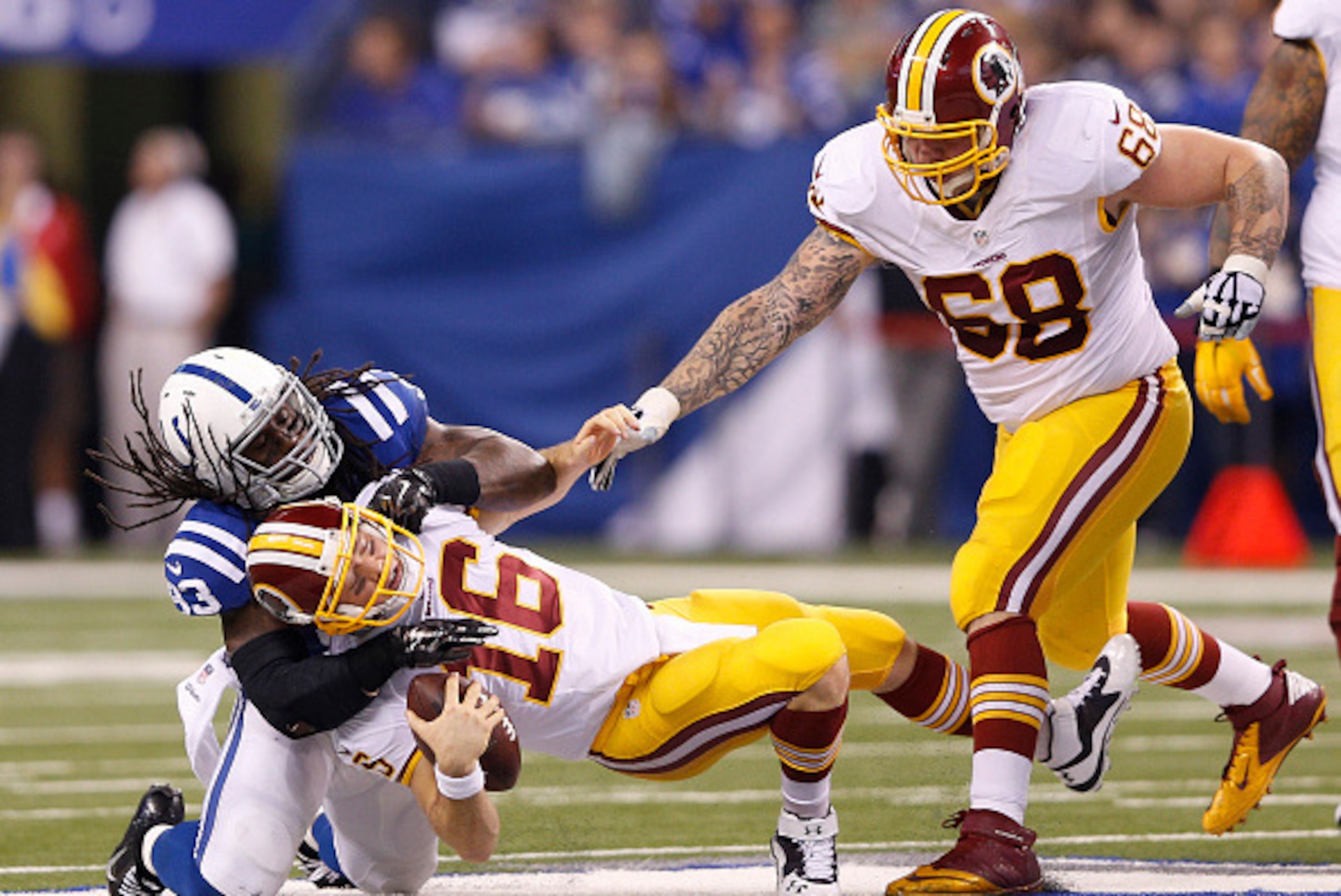 INDIANAPOLIS, IN - NOVEMBER 30: Erik Walden #93 of the Indianapolis Colts sacks Colt McCoy #16 of the Washington Redskins during the first half of the game at Lucas Oil Stadium on November 30, 2014 in Indianapolis, Indiana. (Photo by Joe Robbins/Getty Ima
