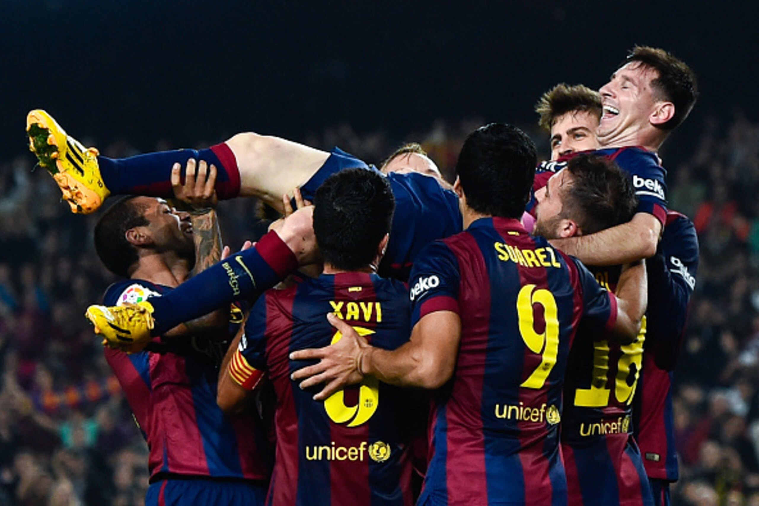 BARCELONA, SPAIN - NOVEMBER 22:  Lionel Messi of FC Barcelona celebrates with his teammates after scoring his team's fourth goal during the La Liga match between FC Barcelona and Sevilla FC at Camp Nou on November 22, 2014 in Barcelona, Spain. Lionel Mess