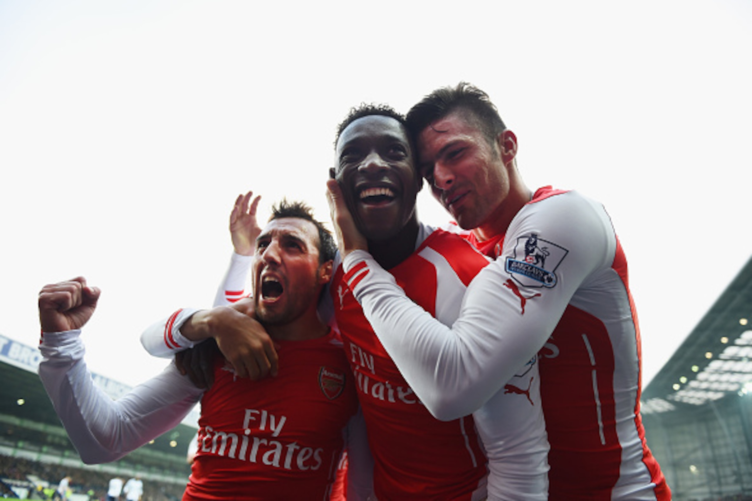 WEST BROMWICH, ENGLAND - NOVEMBER 29: Danny Welbeck of Arsenal (C) celebrates with team mate Olivier Giroud (R) and Santi Cazorla (L) as he scores their first goal during the Barclays Premier League match between West bromwich Albion and Arsenal at The Ha
