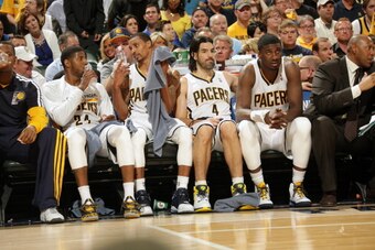 INDIANAPOLIS - APRIL 22:  (L-R) Paul George #24, George Hill #3, Luis Scola #4, and Roy Hibbert #55 of the Indiana Pacers on the bench during the game against the Atlanta Hawks in game two of the East Conference Quarter Finals at Bankers Life Fieldhouse o