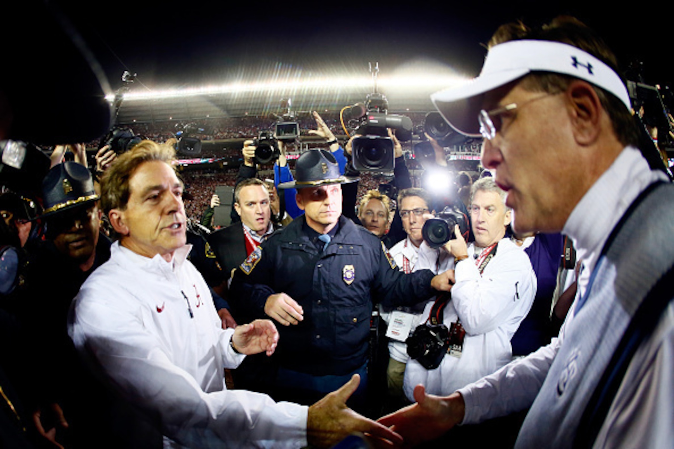 TUSCALOOSA, AL - NOVEMBER 29:  Head coach Nick Saban of the Alabama Crimson Tide shakes hand with head coach Gus Malzahn of the Auburn Tigers after the Iron Bowl at Bryant-Denny Stadium on November 29, 2014 in Tuscaloosa, Alabama. The Alabama Crimson Tide