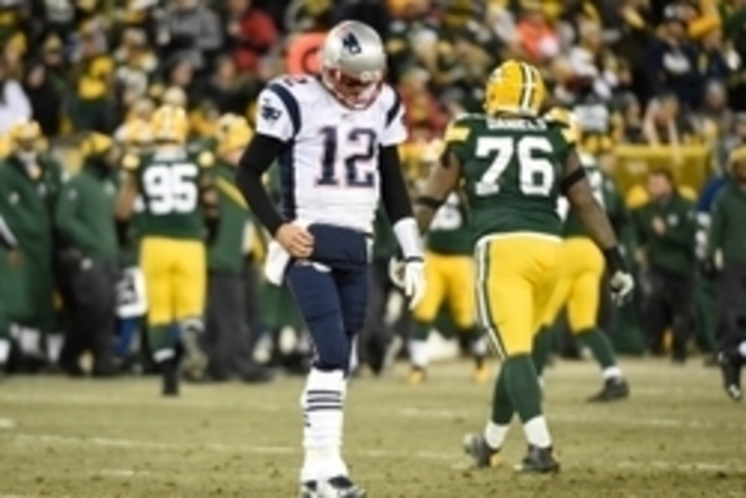 Nov 30, 2014; Green Bay, WI, USA; New England Patriots quarterback Tom Brady (12) walks back to the bench after failing to convert on a third down play in the third quarter during the game against the Green Bay Packers at Lambeau Field. Mandatory Credit: Nov 30, 2014; Green Bay, WI, USA; New England Patriots quarterback Tom Brady (12) walks back to the bench after failing to convert on a third down play in the third quarter during the game against the Green Bay Packers at Lambeau Field. Mandatory Credit: