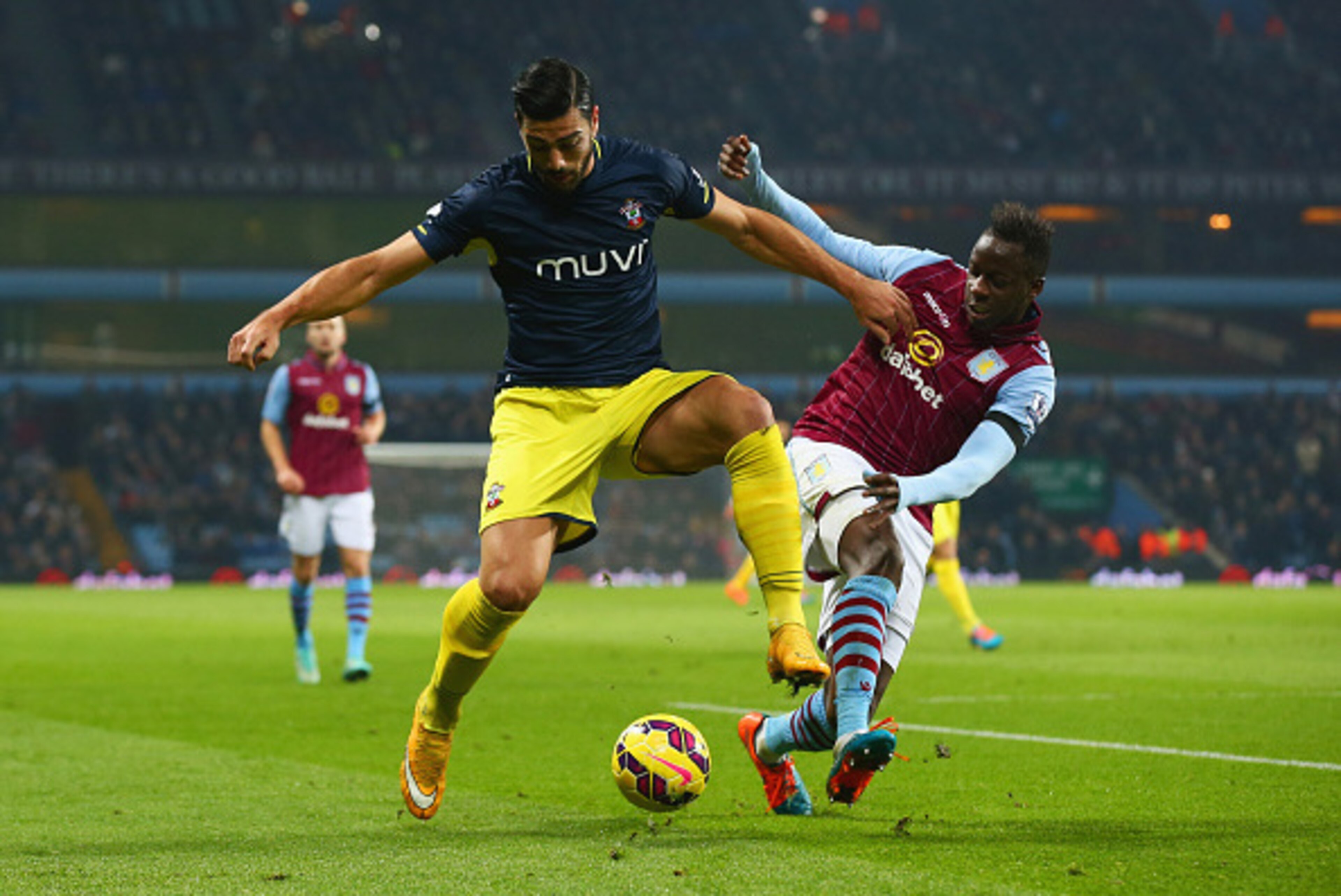 BIRMINGHAM, ENGLAND - NOVEMBER 24:  Graziano Pelle of Southampton holds off Aly Cissokho of Aston Villa during the Barclays Premier League match between Aston Villa and Southampton at Villa Park on November 24, 2014 in Birmingham, England.  (Photo by Matt