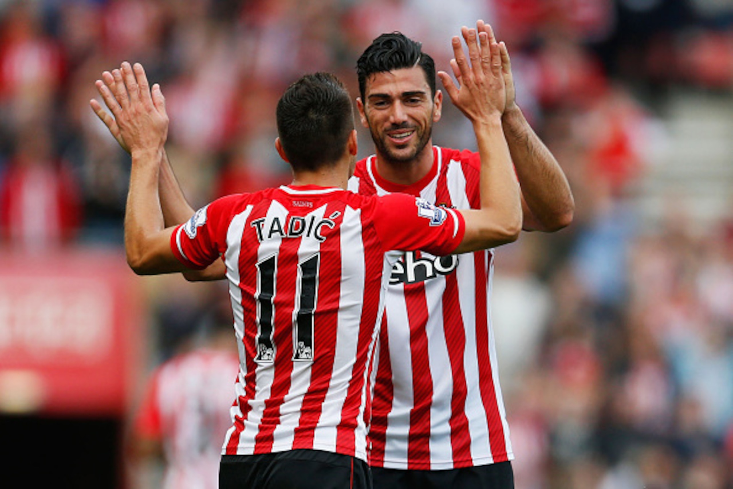 SOUTHAMPTON, ENGLAND - OCTOBER 18:  Dusan Tadic (11) and Graziano Pelle of Southampton (19) celebrate a goal during the Barclays Premier League match between Southampton and Sunderland at St Mary's Stadium on October 18, 2014 in Southampton, England.  (Ph
