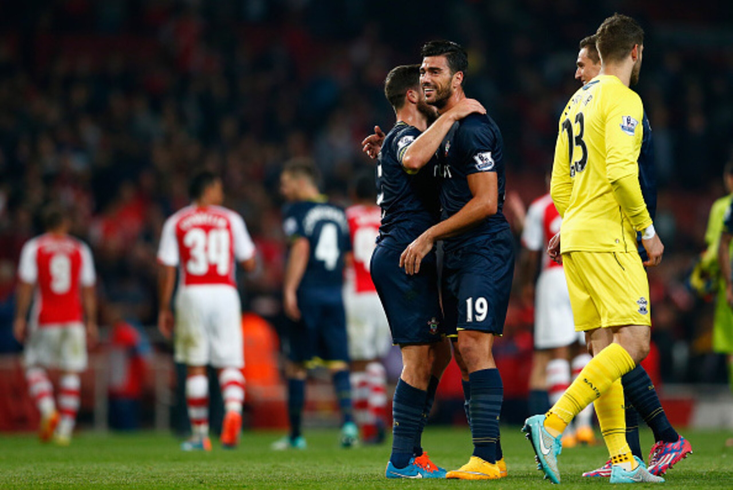 LONDON, ENGLAND - SEPTEMBER 23:  Graziano Pelle of Southampton and Shane Long of Southampton celebrate at full time during the Capital One Cup Third Round match between Arsenal and Southampton at the Emirates Stadium on September 23, 2014 in London, Engla