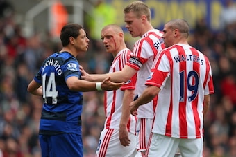STOKE ON TRENT, ENGLAND - APRIL 14:  Javier Hernandez of Manchester United clashes with Ryan Shawcross of Stoke City during the Barclays Premier League match between Stoke City and Manchester United at the Britannia Stadium on April 14, 2013 in Stoke on T
