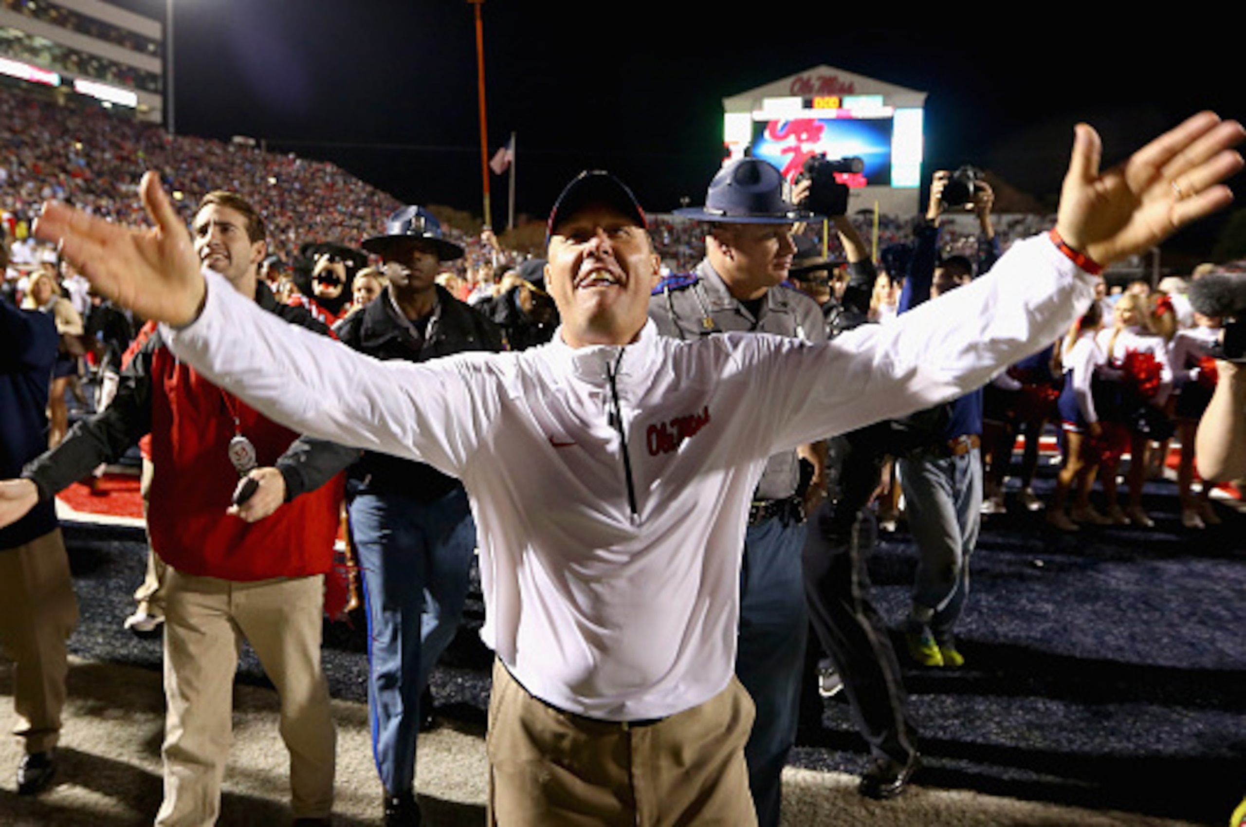 OXFORD, MS - NOVEMBER 29:  Head coach Hugh Freeze of the Mississippi Rebels celebrates after defeating the Mississippi State Bulldogs 31-17 at Vaught-Hemingway Stadium on November 29, 2014 in Oxford, Mississippi.  (Photo by Streeter Lecka/Getty Images)