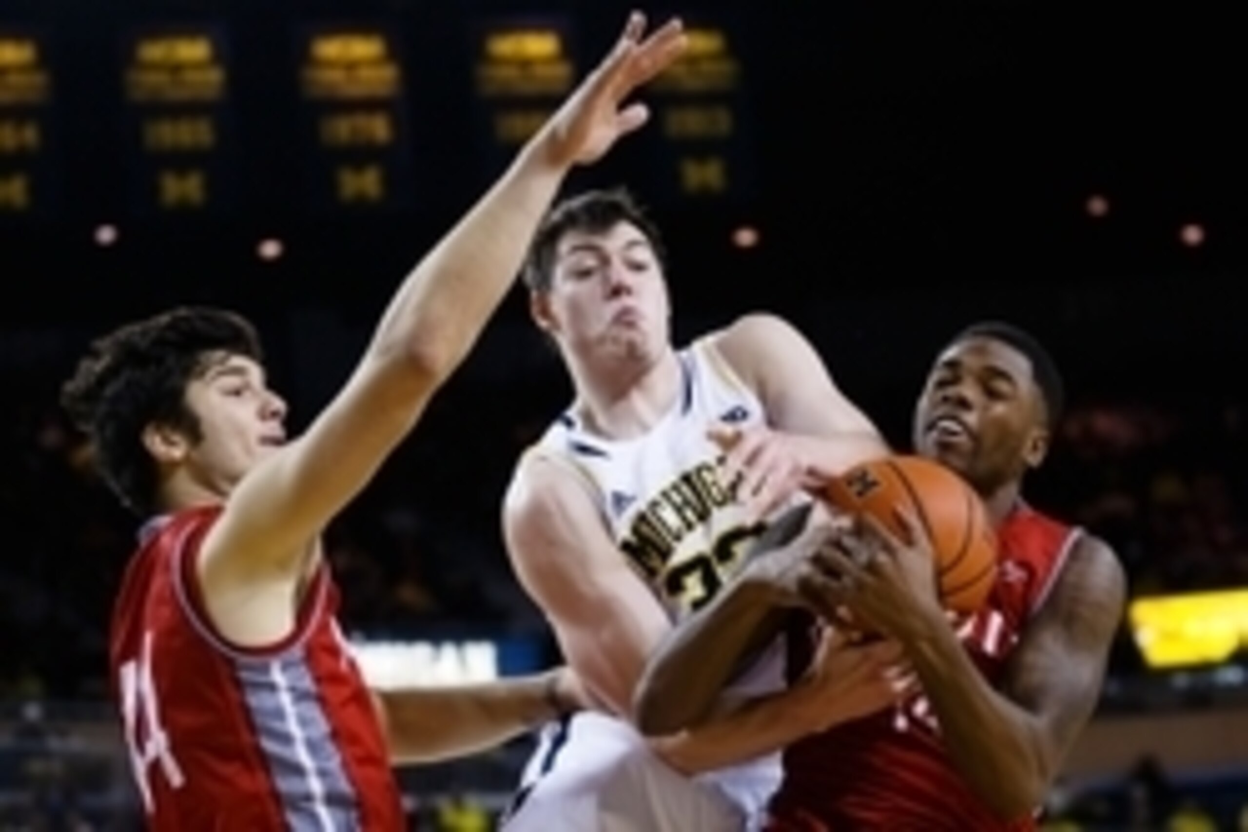 Nov 29, 2014; Ann Arbor, MI, USA; Michigan Wolverines forward Ricky Doyle (32) Nicholls State Colonels forward Ja'Dante' Frye (14) and forward Luka Kamber (44) battle for the ball in the first half at Crisler Center. Mandatory Credit: Rick Osentoski-USA T Nov 29, 2014; Ann Arbor, MI, USA; Michigan Wolverines forward Ricky Doyle (32) Nicholls State Colonels forward Ja'Dante' Frye (14) and forward Luka Kamber (44) battle for the ball in the first half at Crisler Center. Mandatory Credit: Rick Osentoski-USA T