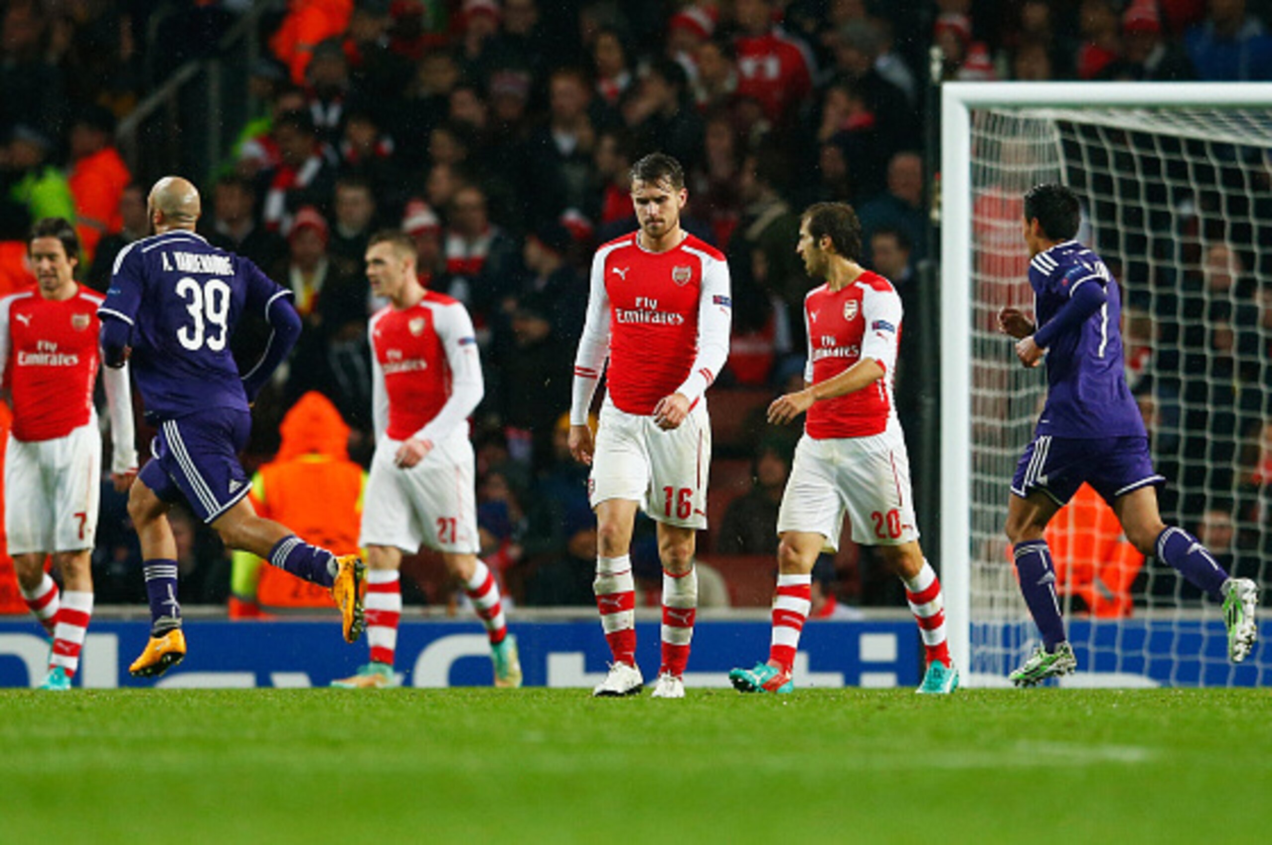 LONDON, ENGLAND - NOVEMBER 04:  Despair for Aaron Ramsey of Arsenal (16) and team mates as Aleksandar Mitrovic of Anderlecht (not pictured) scores their third goal during the UEFA Champions League Group D match between Arsenal FC and RSC Anderlecht at Emi