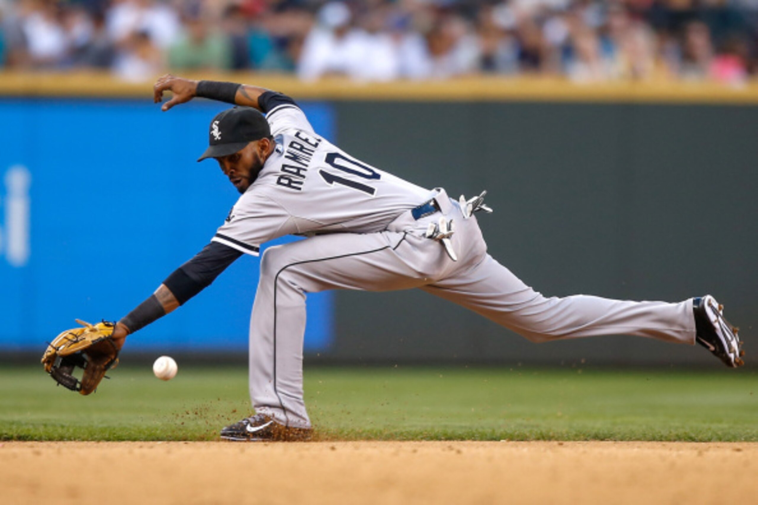 SEATTLE, WA - AUGUST 09:  Shortstop Alexei Ramirez #10 of the Chicago White Sox reaches for a single off the bat of Mike Zunino of the Seattle Mariners in the seventh inning at Safeco Field on August 9, 2014 in Seattle, Washington.  (Photo by Otto Greule 