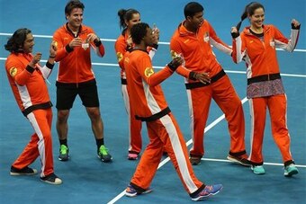 Gael Monfils leads members of the Indian Aces in a post-victory dance in Manila.