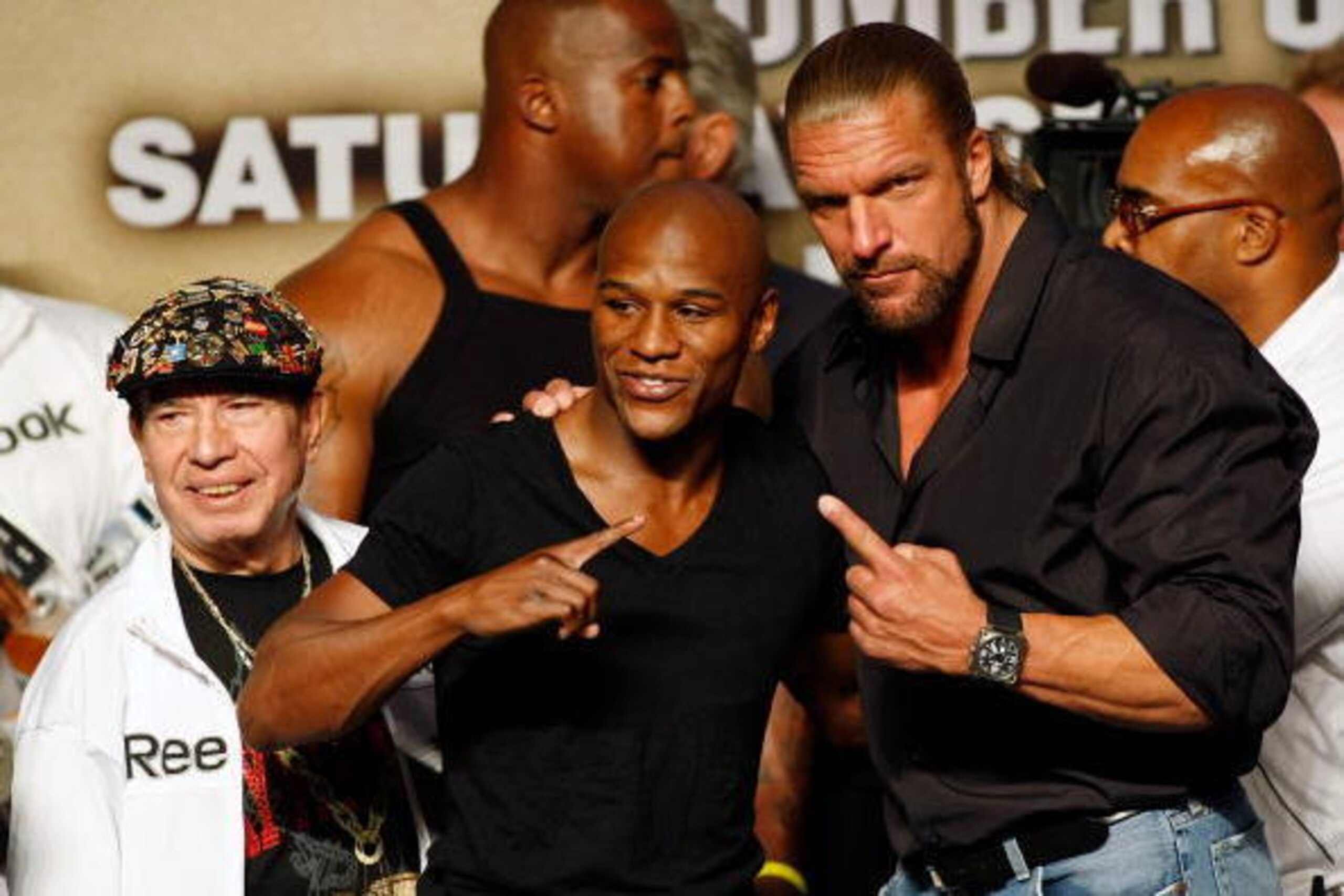 LAS VEGAS - SEPTEMBER 18:  (L-R) Cornerman Rafael Garcia, boxer Floyd Mayweather Jr. and WWE wrestler Triple H pose during the official weigh-in for Mayweather's fight against Juan Manuel Marquez at the MGM Grand Garden Arena September 18, 2009 in Las Veg