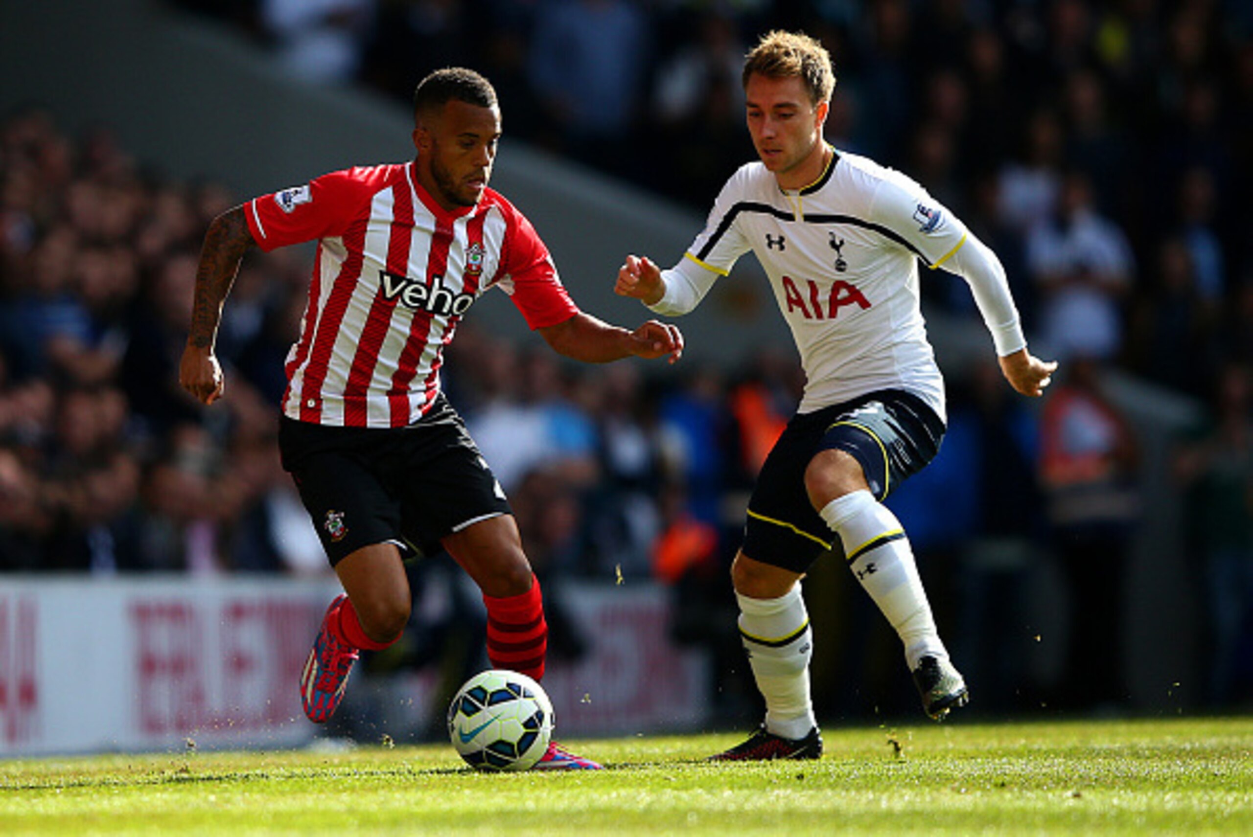 LONDON, ENGLAND - OCTOBER 05:  Christian Eriksen of Spurs battles for the ball with Ryan Bertrand of Southampton during the Barclays Premier League match between Tottenham Hotspur and Southampton at White Hart Lane on October 5, 2014 in London, England.  