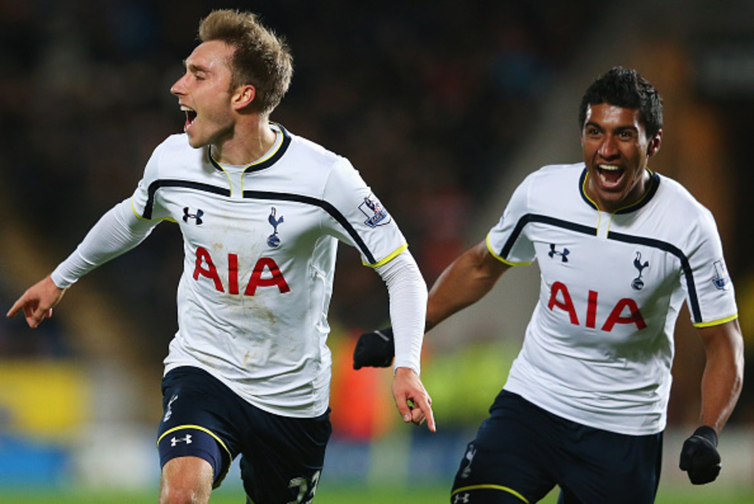 HULL, ENGLAND - NOVEMBER 23:  Christian Eriksen of Tottenham Hotspur celebrates scoring the winning goal with Paulinho during the Barclays Premier League match between Hull City and Tottenham Hotspur at KC Stadium on November 23, 2014 in Hull, England.  (