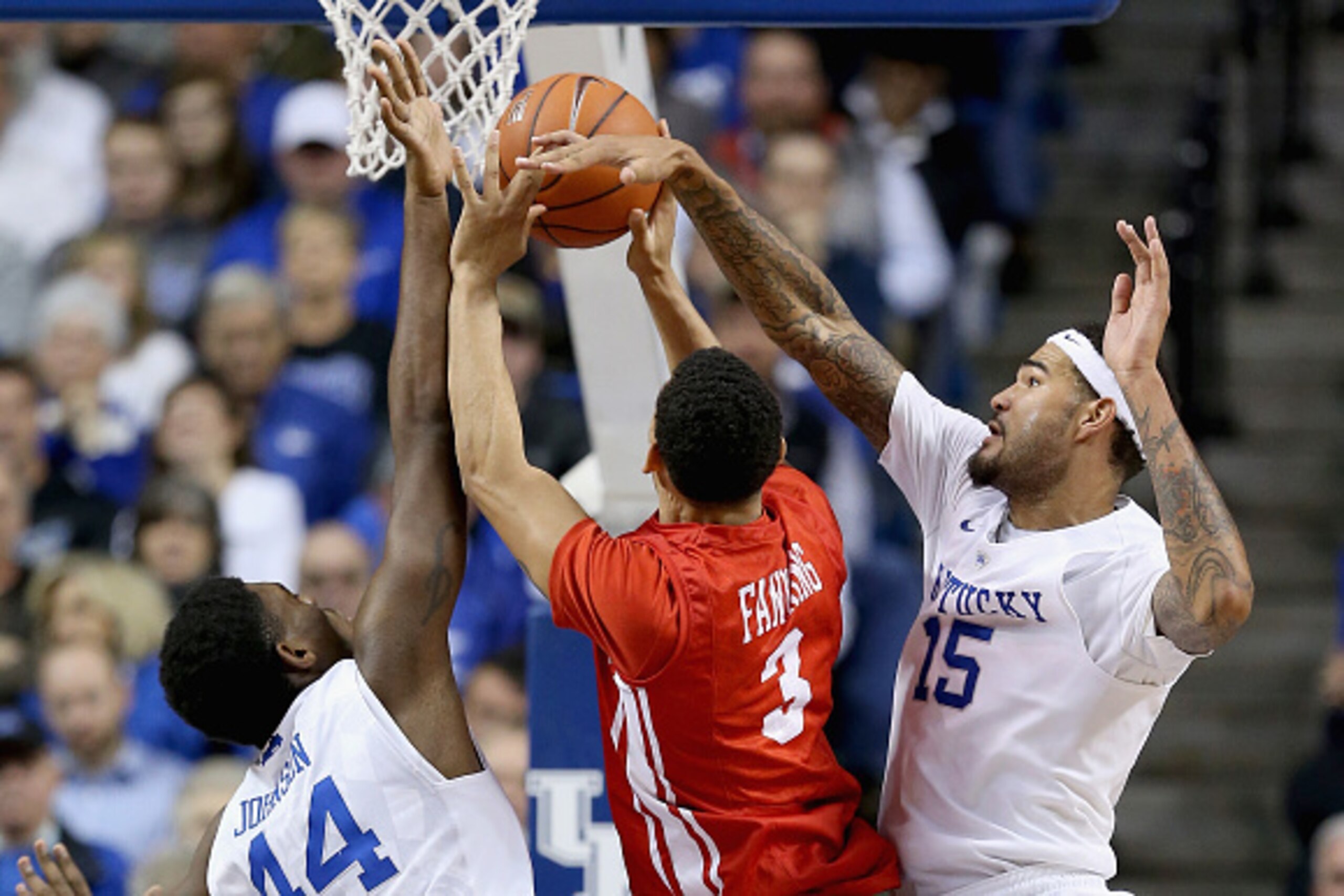 LEXINGTON, KY - NOVEMBER 21:  Dakari Johnson #44 and Willie Cauley-Stein #15 of the Kentucky Wildcats defend the shot of  Eric Fanning #3 of the Boston Terriers battle for a loose ball at Rupp Arena on November 21, 2014 in Lexington, Kentucky.  (Photo by 
