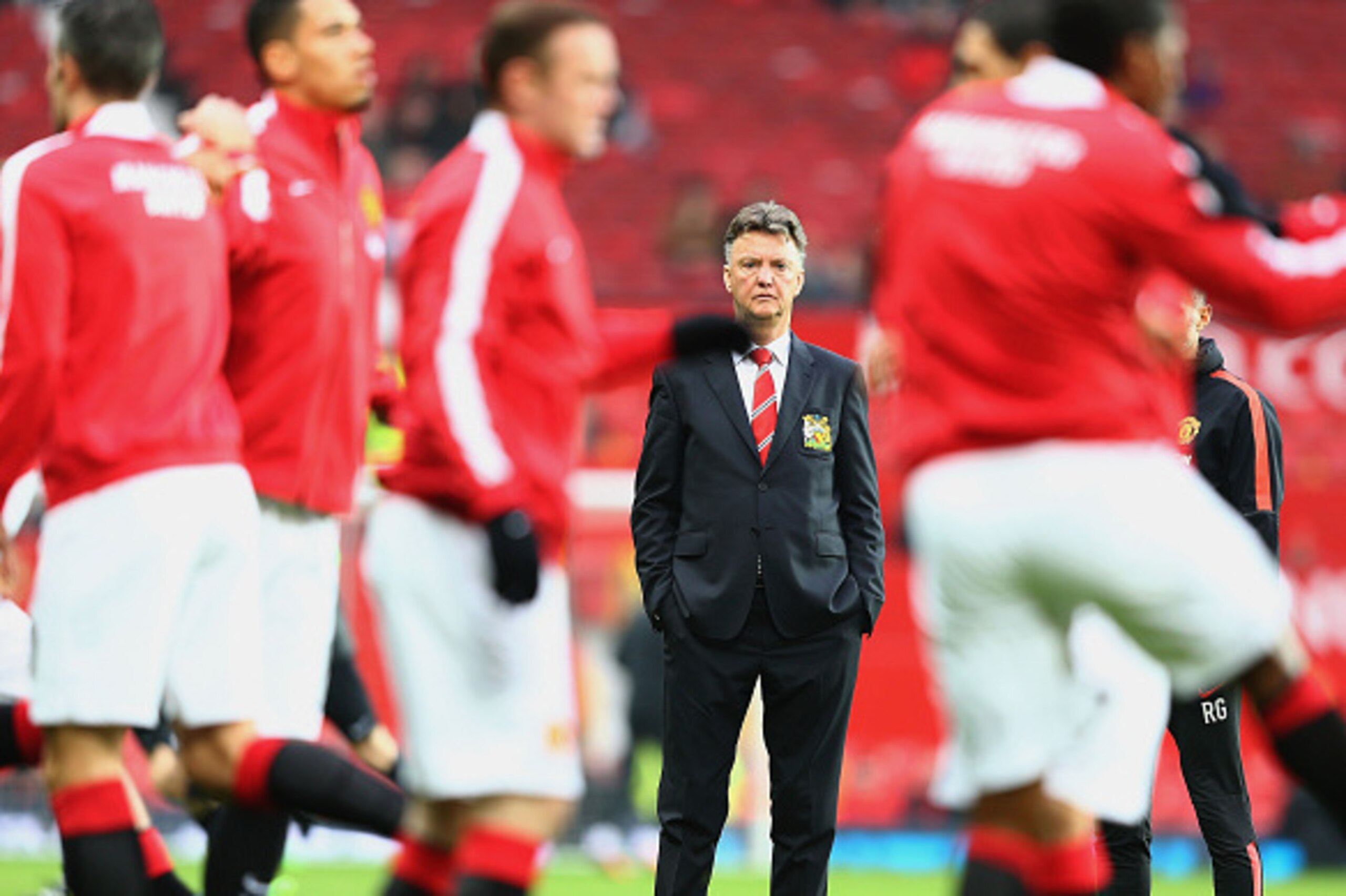 MANCHESTER, ENGLAND - NOVEMBER 29:  Louis van Gaal manager of Manchester United watches players warm up prior to the Barclays Premier League match between Manchester United and Hull City at Old Trafford on November 29, 2014 in Manchester, England.  (Photo
