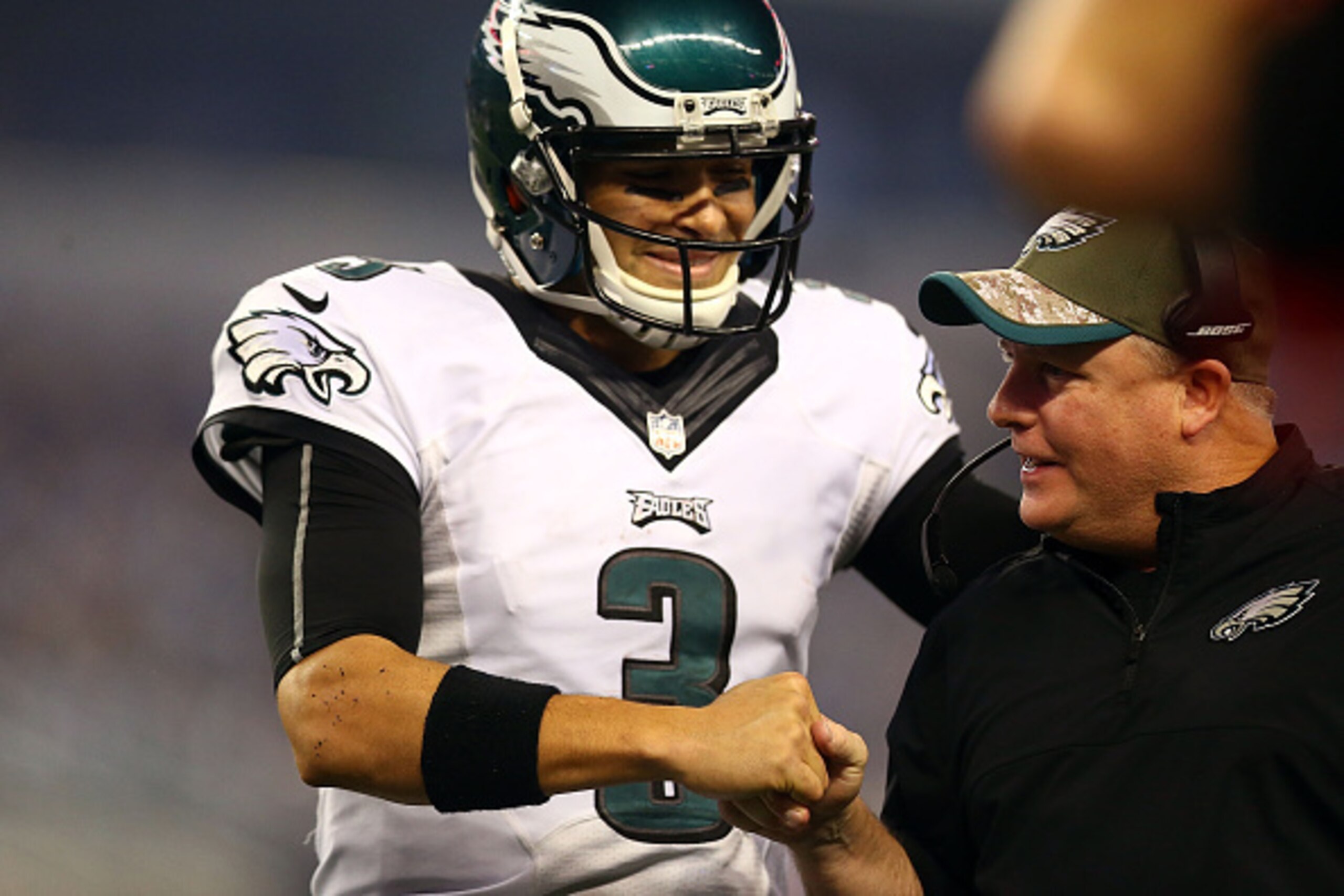 ARLINGTON, TX - NOVEMBER 27:  Mark Sanchez #3 of the Philadelphia Eagles and Head coach Chip Kelly of the Philadelphia Eagles shake hands in the second half against the Dallas Cowboys at AT&T Stadium on November 27, 2014 in Arlington, Texas.  (Photo by Ro