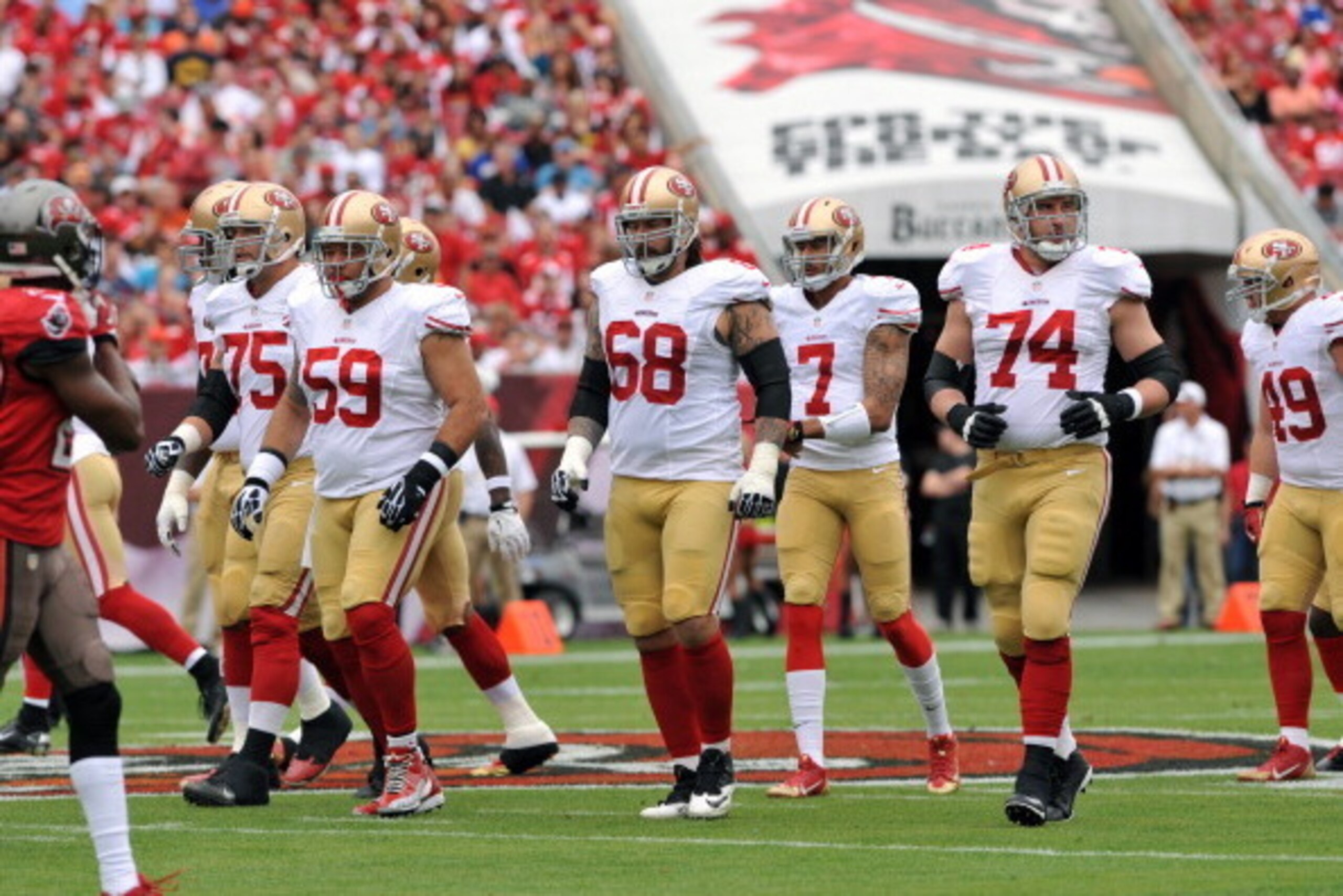 TAMPA, FL - DECEMBER 15: Center Jonathan Goodwin #59 and the offensive line of the San Francisco 49ers set for play against the Tampa Bay Buccaneers December 15, 2013 at Raymond James Stadium in Tampa, Florida. (Photo by Al Messerschmidt/Getty Images) TAMPA, FL - DECEMBER 15: Center Jonathan Goodwin #59 and the offensive line of the San Francisco 49ers set for play against the Tampa Bay Buccaneers December 15, 2013 at Raymond James Stadium in Tampa, Florida. (Photo by Al Messerschmidt/Getty Images)