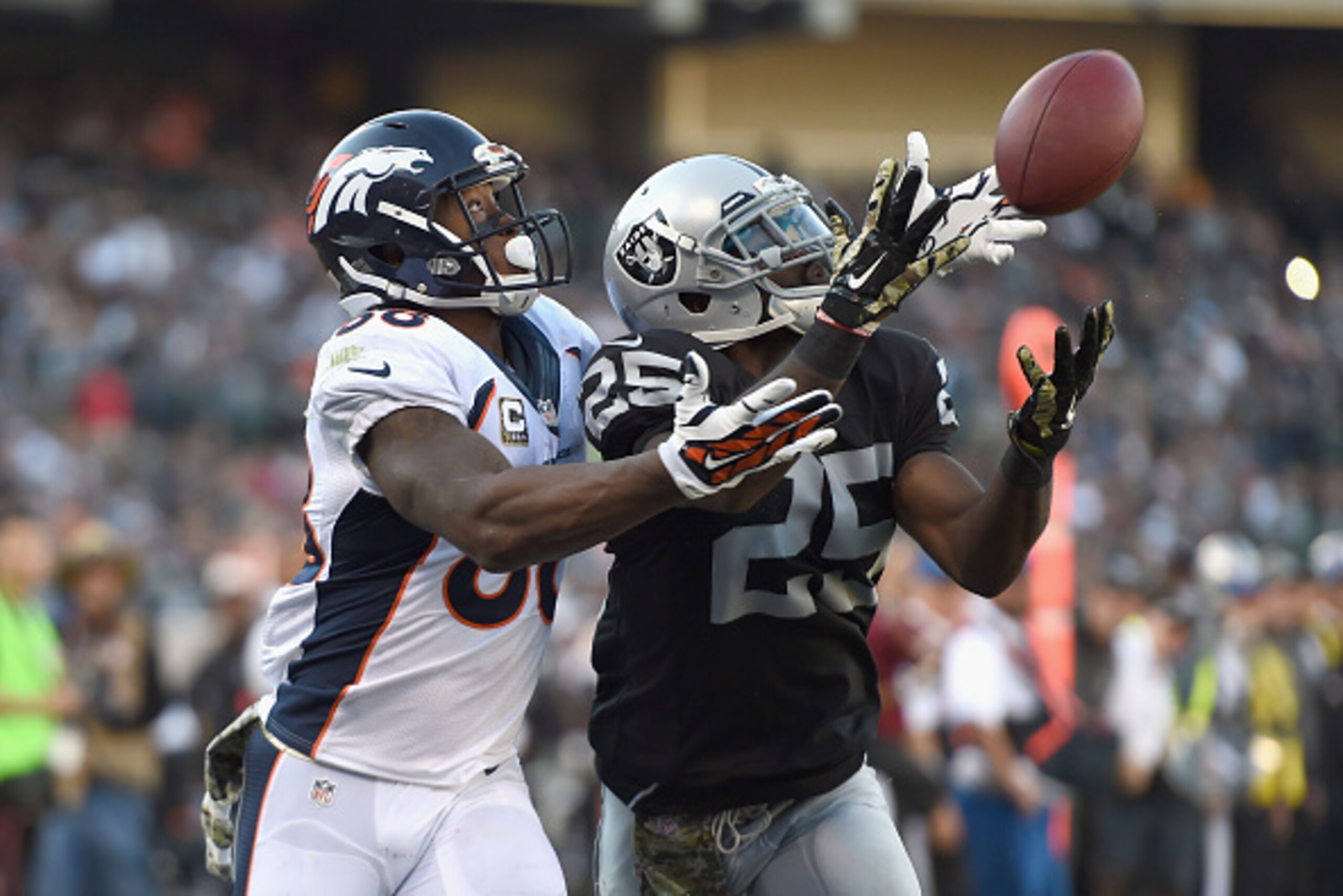 OAKLAND, CA - NOVEMBER 09: D.J. Hayden #25 of the Oakland Raiders cannot complete the reception against the defense of Demaryius Thomas #88 of the Denver Broncos in the third quarter at O.co Coliseum on November 9, 2014 in Oakland, California. (Photo by T OAKLAND, CA - NOVEMBER 09: D.J. Hayden #25 of the Oakland Raiders cannot complete the reception against the defense of Demaryius Thomas #88 of the Denver Broncos in the third quarter at O.co Coliseum on November 9, 2014 in Oakland, California. (Photo by T