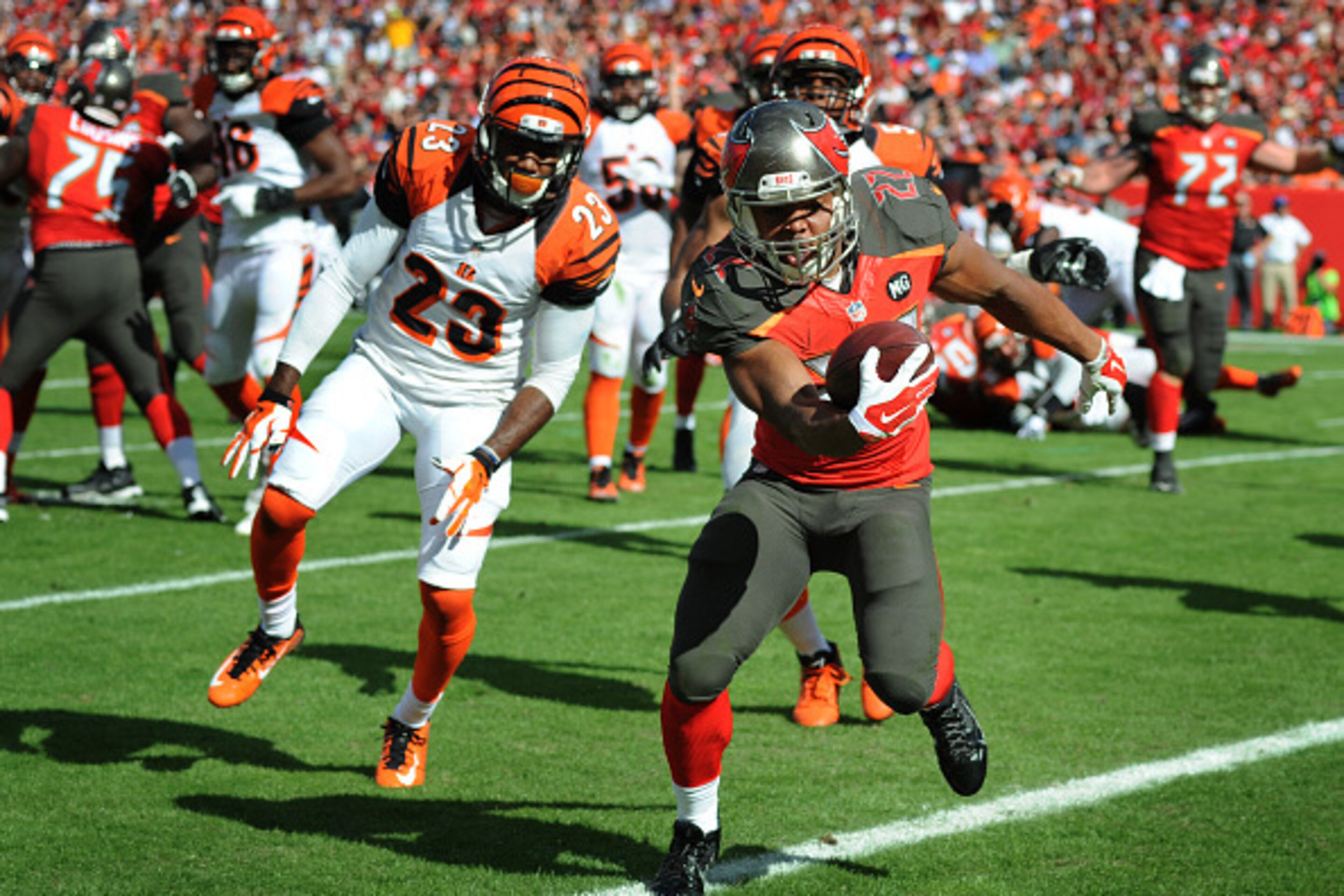 TAMPA, FL - NOVEMBER 30: Running back Doug Martin #22 of the Tampa Bay Buccaneers runs for a TD against the Cincinnati Bengals in the second quarter at Raymond James Stadium on November 30, 2014 in Tampa, Florida. (Photo by Cliff McBride/Getty Images) TAMPA, FL - NOVEMBER 30: Running back Doug Martin #22 of the Tampa Bay Buccaneers runs for a TD against the Cincinnati Bengals in the second quarter at Raymond James Stadium on November 30, 2014 in Tampa, Florida. (Photo by Cliff McBride/Getty Images)