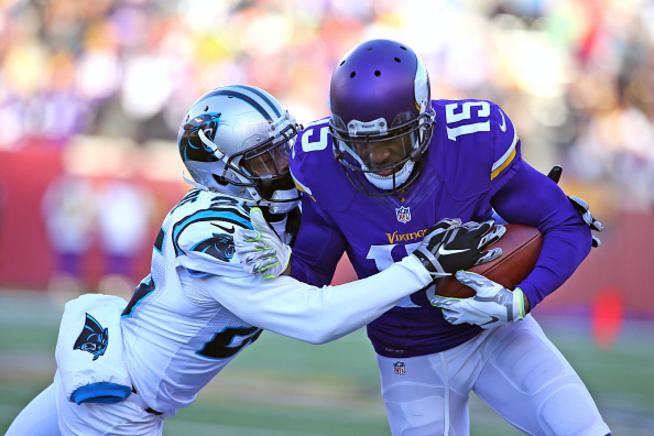 MINNEAPOLIS, MN - NOVEMBER 30: Bene' Benwikere #25 of the Carolina Panthers attempts to tackle Greg Jennings #15 of the Minnesota Vikings in the fourth quarter on November 30, 2014 at TCF Bank Stadium in Minneapolis, Minnesota. (Photo by Adam Bettcher/Get