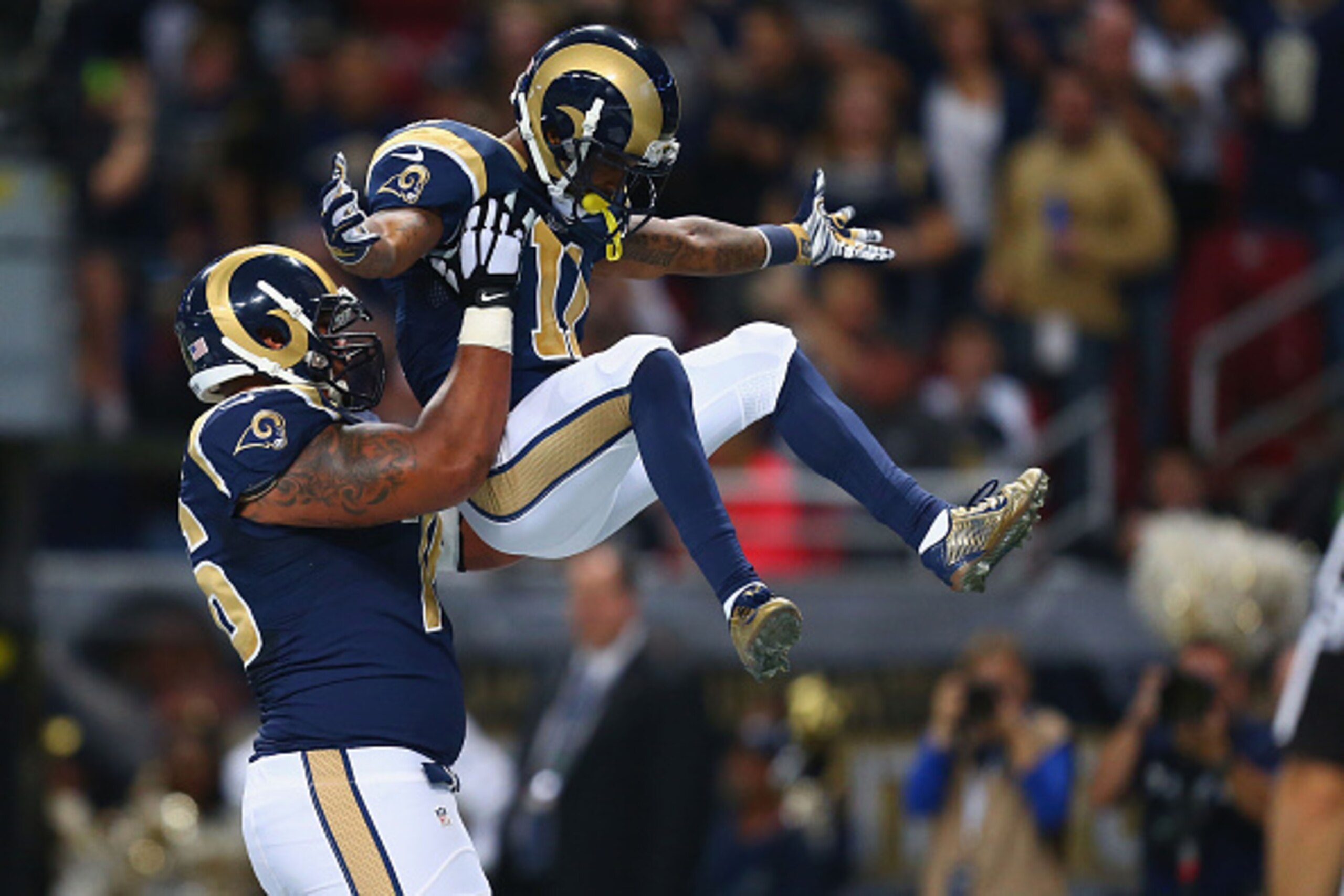 ST. LOUIS, MO - NOVEMBER 30: Rodger Saffold #76 and Tavon Austin #11 of the St. Louis Rams celebrate Austin's first quarter touchdown against the Oakland Raiders at the Edward Jones Dome on November 30, 2014 in St. Louis, Missouri.  (Photo by Dilip Vishwa