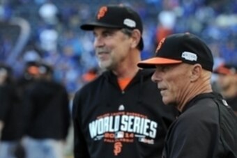 Oct 22, 2014; Kansas City, MO, USA; San Francisco Giants third base coach Tim Flannery (right) stands with manager Bruce Bochy (rear) before game two of the 2014 World Series against the Kansas City Royals at Kauffman Stadium. Mandatory Credit: Christophe