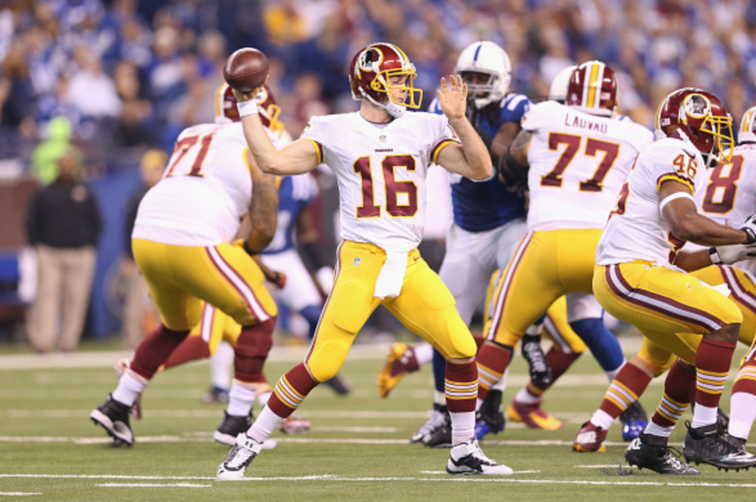INDIANAPOLIS, IN - NOVEMBER 30:  Colt McCoy #16 of the Washington Redskins throws a pass during the game against the Indianapolis Colts at Lucas Oil Stadium on November 30, 2014 in Indianapolis, Indiana.  (Photo by Andy Lyons/Getty Images)