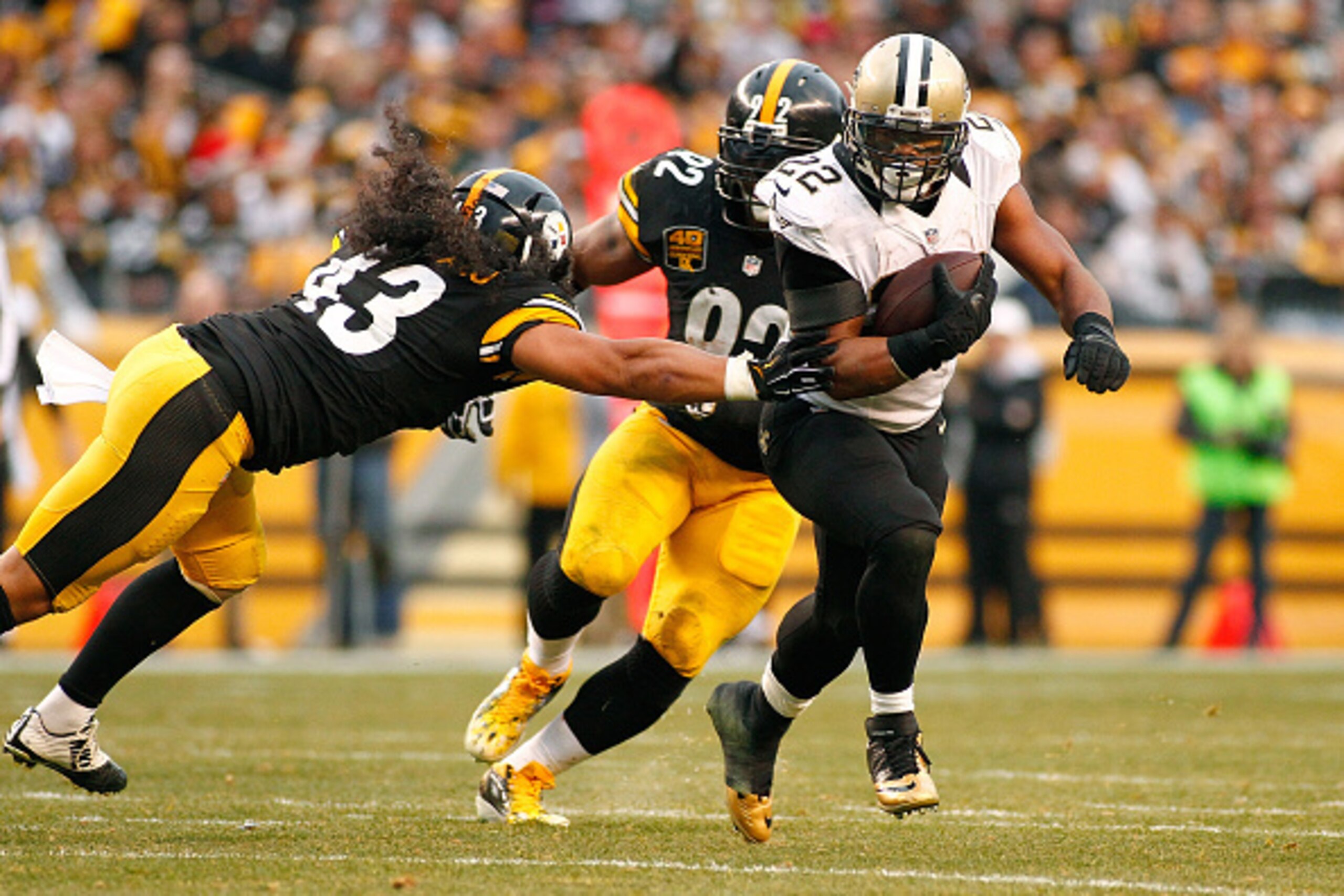 PITTSBURGH, PA - NOVEMBER 30:  Mark Ingram #22 of the New Orleans Saints carries the ball in front of Troy Polamalu #43 of the Pittsburgh Steelers during the fourth quarter at Heinz Field on November 30, 2014 in Pittsburgh, Pennsylvania.  (Photo by Justin