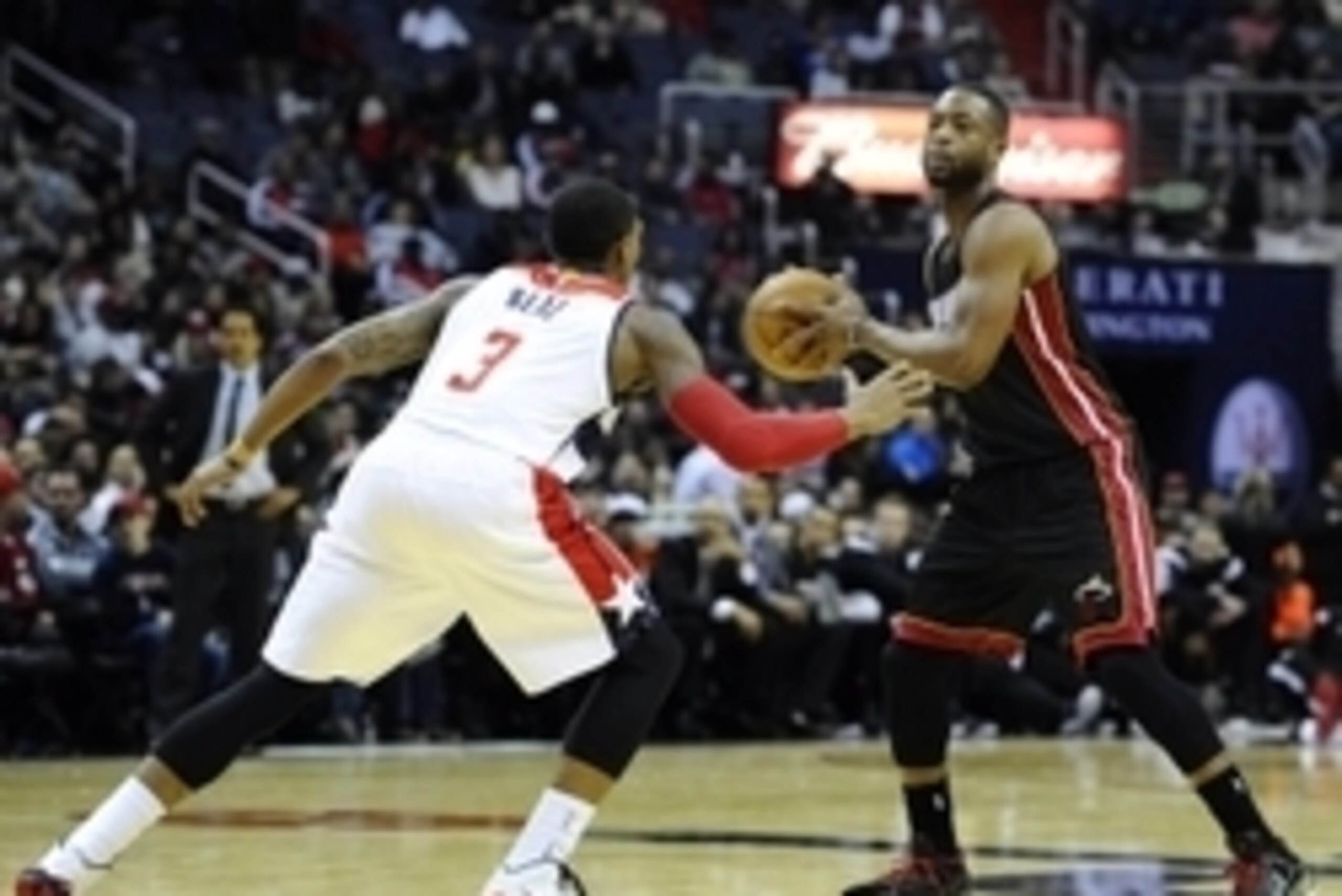 Dec 1, 2014; Washington, DC, USA; Miami Heat guard Dwyane Wade (3) looks to pass as Washington Wizards guard Bradley Beal (3) defends during the second half at Verizon Center. The Wizards won 107 - 86. Mandatory Credit: Brad Mills-USA TODAY Sports