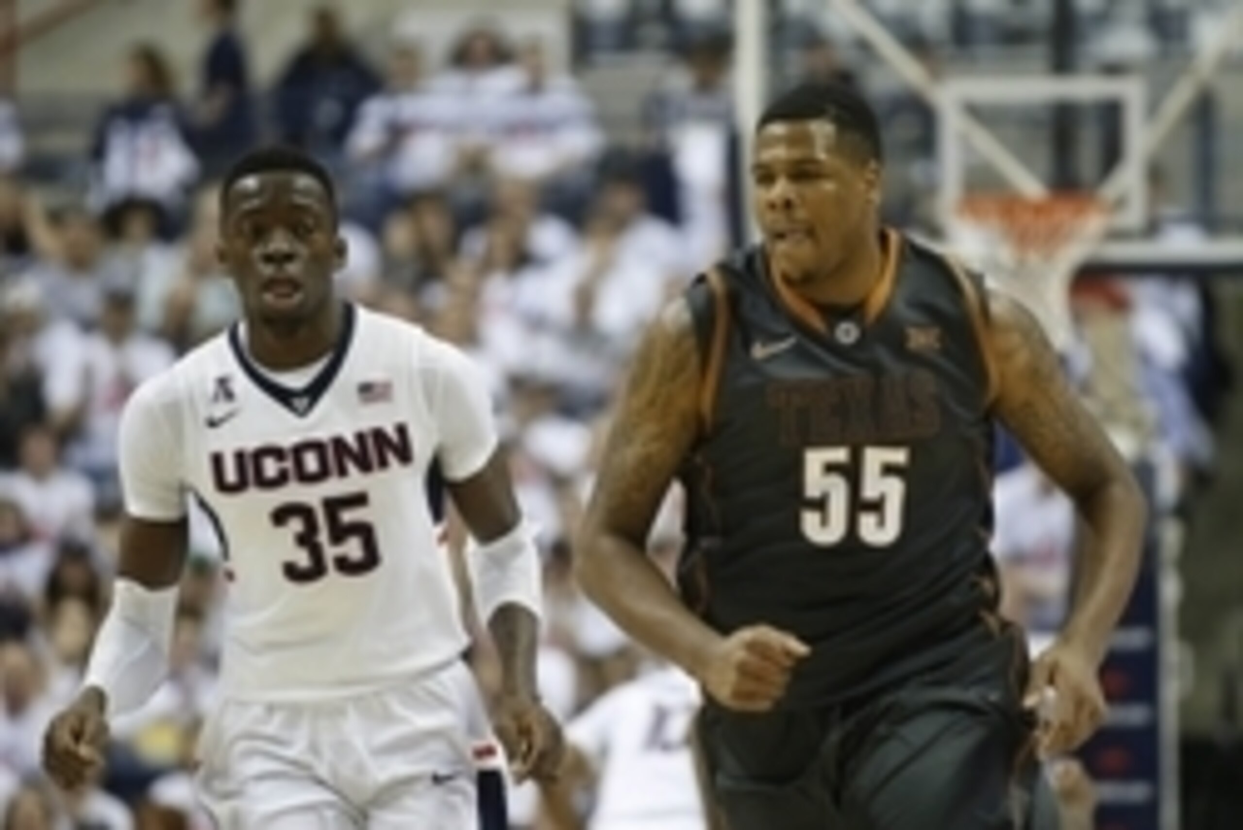 Nov 30, 2014; Storrs, CT, USA; Connecticut Huskies center Amida Brimah (35) and Texas Longhorns center Cameron Ridley (55) return up court in the second half at Harry A. Gampel Pavilion. Mandatory Credit: David Butler II-USA TODAY Sports