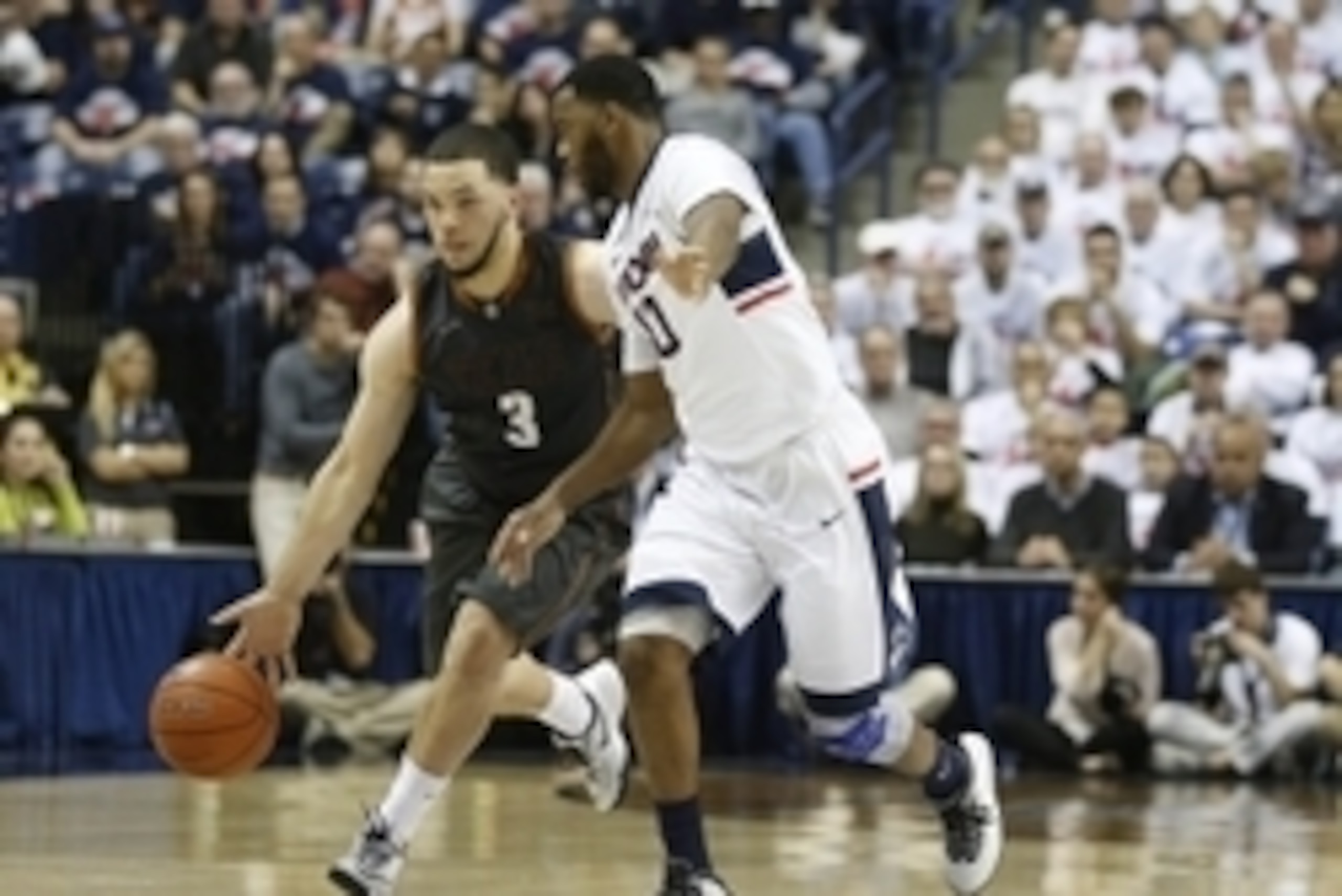 Nov 30, 2014; Storrs, CT, USA; Texas Longhorns guard Javan Felix (3) drives against Connecticut Huskies guard Sam Cassell Jr. (10) in the second half at Harry A. Gampel Pavilion. Mandatory Credit: David Butler II-USA TODAY Sports