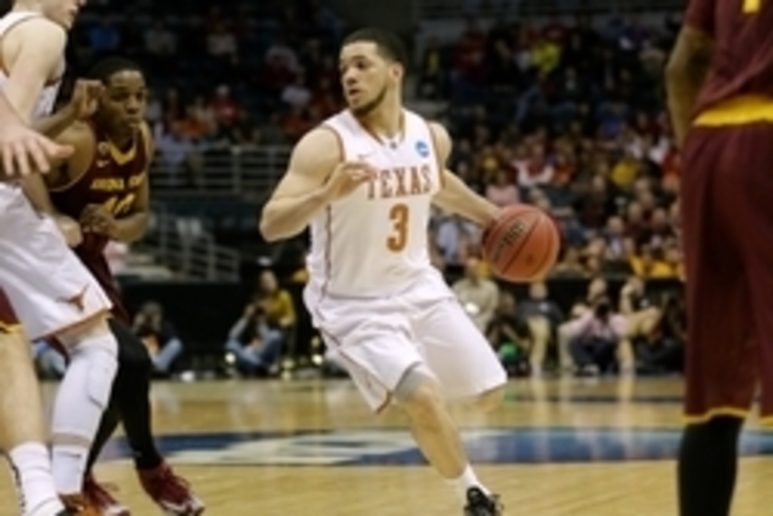 Mar 20, 2014; Milwaukee, WI, USA; Texas Longhorns guard Javan Felix (3) drives to the basket during the second round of the 2014 NCAA Tournament against the Arizona State Sun Devils at BMO Harris Bradley Center. Mandatory Credit: Jeff Hanisch-USA TODAY Sp