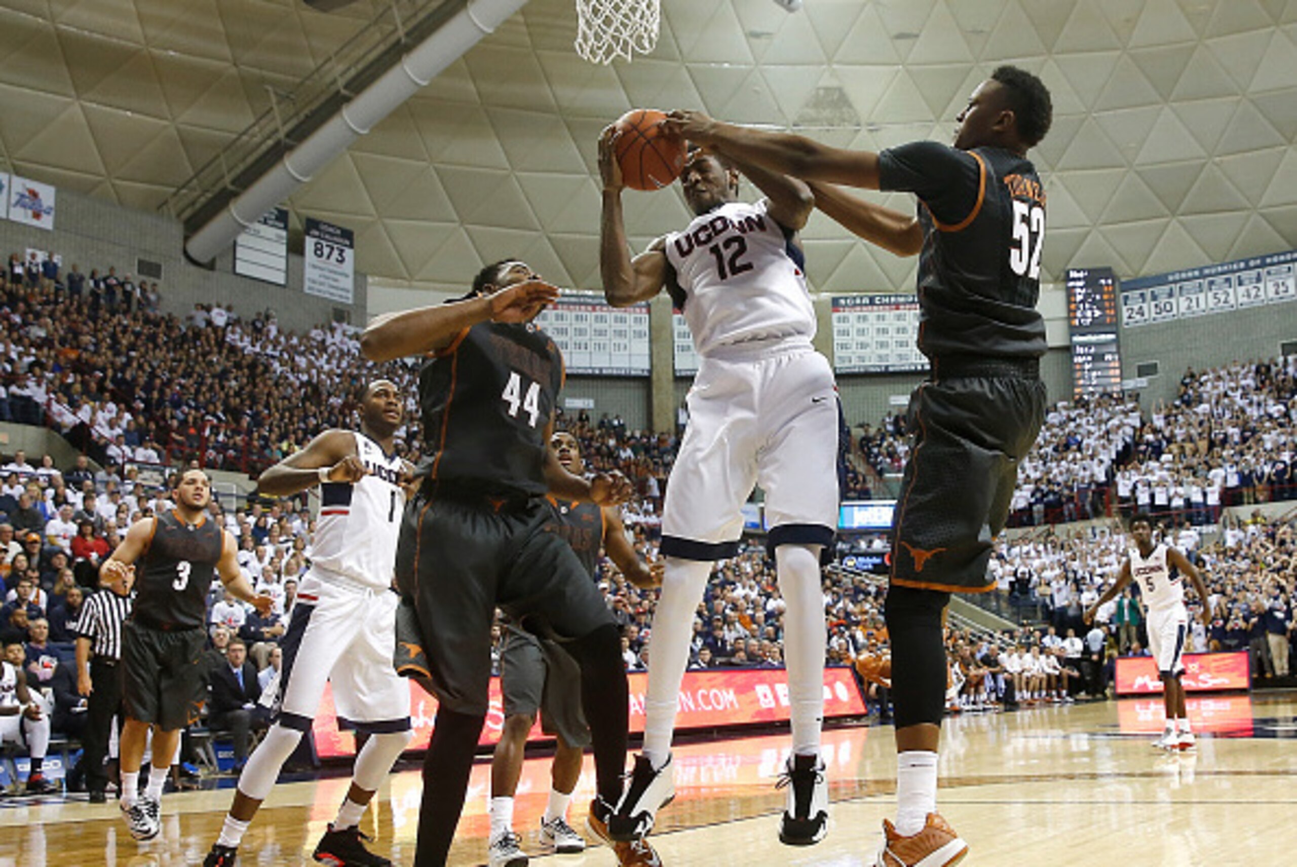 STORRS, CT- NOVEMBER 30:  Prince Ibeh #44 and Myles Turner #52 of the Texas Longhorns defend against Kentan Facey #12 of the Connecticut Huskies in the second half at Harry A. Gampel Pavilion on November 30, 2014 in Storrs, Connecticut. (Photo by Jim Roga