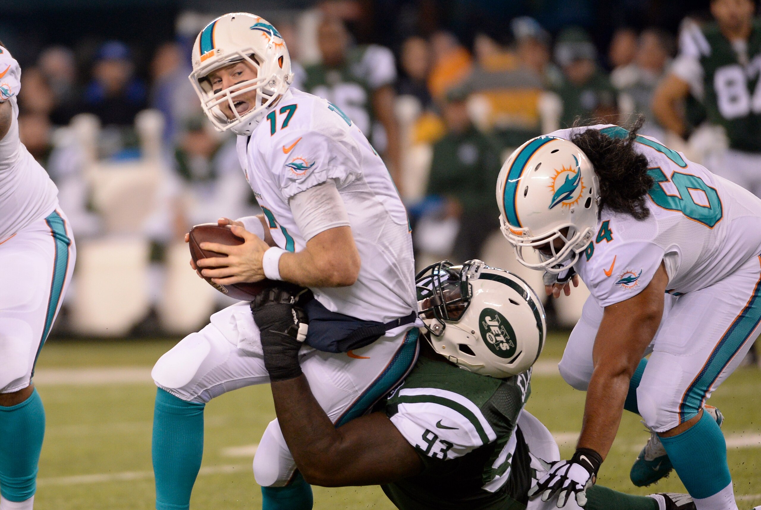 Dec 1, 2014; East Rutherford, NJ, USA; Miami Dolphins quarterback Ryan Tannehill (17) is sacked by New York Jets defensive end Kenrick Ellis (93) at MetLife Stadium. Mandatory Credit: Robert Deutsch-USA TODAY Sports