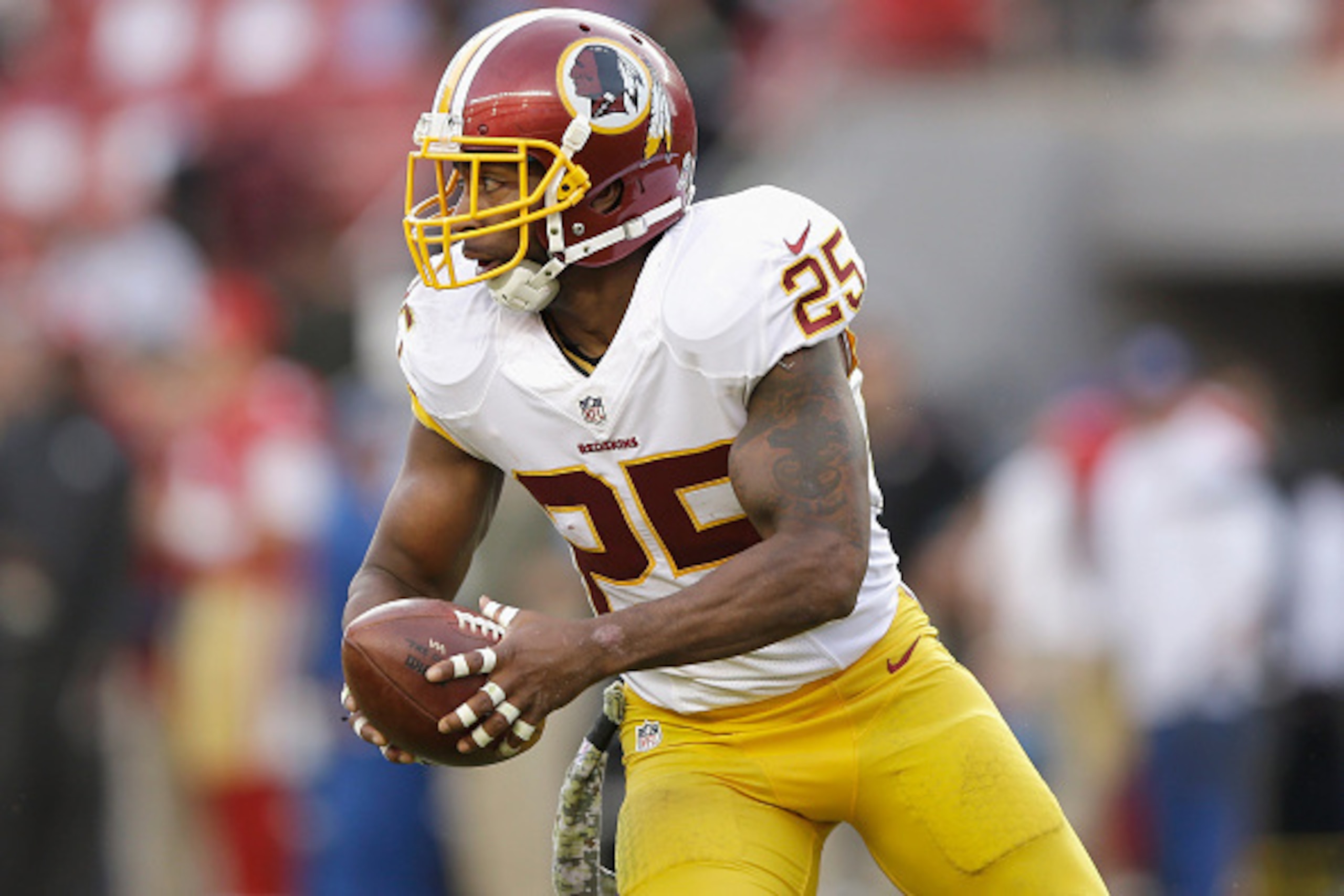 SANTA CLARA, CA - NOVEMBER 23: Ryan Clark #25 of the Washington Redskins gains yardage in the third quarter against the San Francisco 49ers at Levi's Stadium on November 23, 2014 in Santa Clara, California.  (Photo by Ezra Shaw/Getty Images)