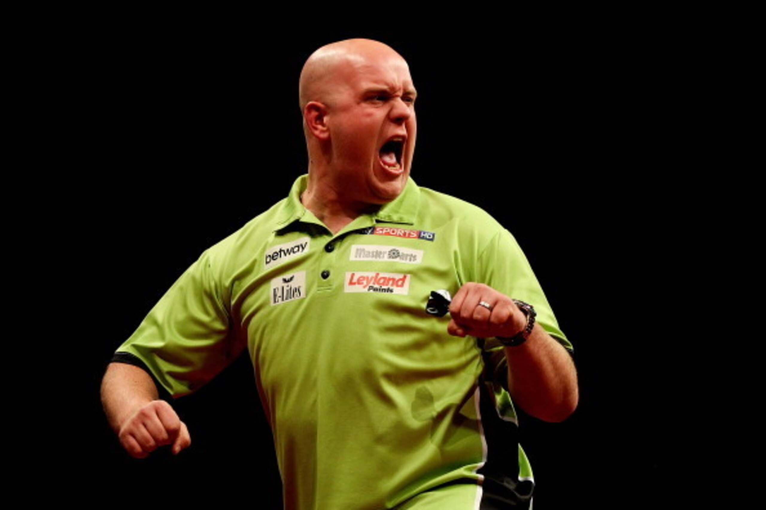 LONDON, ENGLAND - MAY 22: Michael van Gerwen of the Netherlands celebrates winning a leg during the McCoys Premier League Darts Play-Offs Semi Final match between Michael van Gerwen and Gary Anderson at O2 Arena on May 22, 2014 in London, England.  (Photo