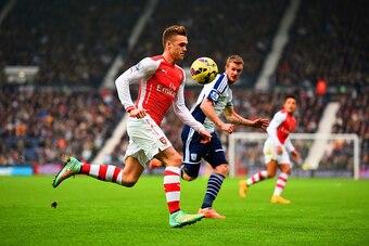 WEST BROMWICH, ENGLAND - NOVEMBER 29:  Calum Chambers of Arsenal and Chris Brunt of West Brom chase the ball during the Barclays Premier League match between West Bromwich Albion and Arsenal at The Hawthorns on November 29, 2014 in West Bromwich, England.