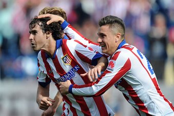 MADRID, SPAIN - OCTOBER 19:  Tiago Mendes of Club Atletico de Madrid celebrates after scoring his team's opening goal during the La Liga match between Club Atletico de Madrid and RCD Espanyol at Vicente Calderon Stadium on October 19, 2014 in Madrid, Spai