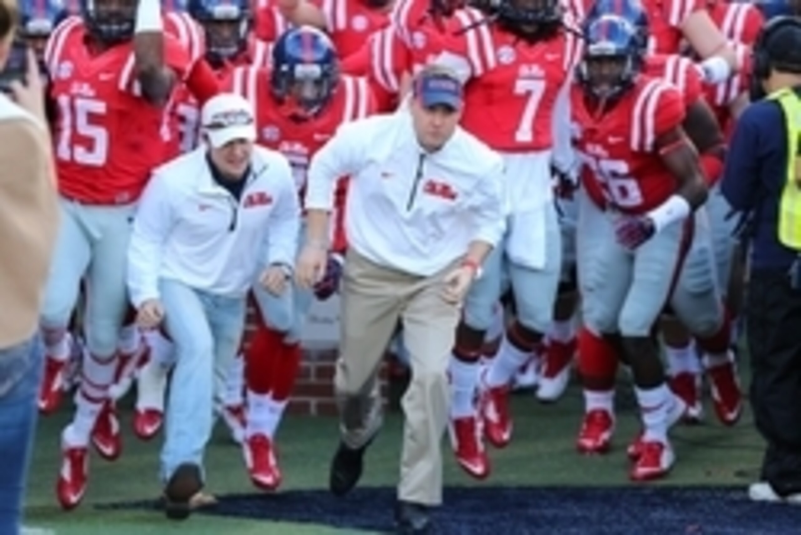 Nov 29, 2014; Oxford, MS, USA; Mississippi Rebels head coach Hugh Freeze leads the Mississippi Rebels onto the field before the game against the Mississippi State Bulldogs at Vaught-Hemingway Stadium. Mandatory Credit: Spruce Derden-USA TODAY Sports