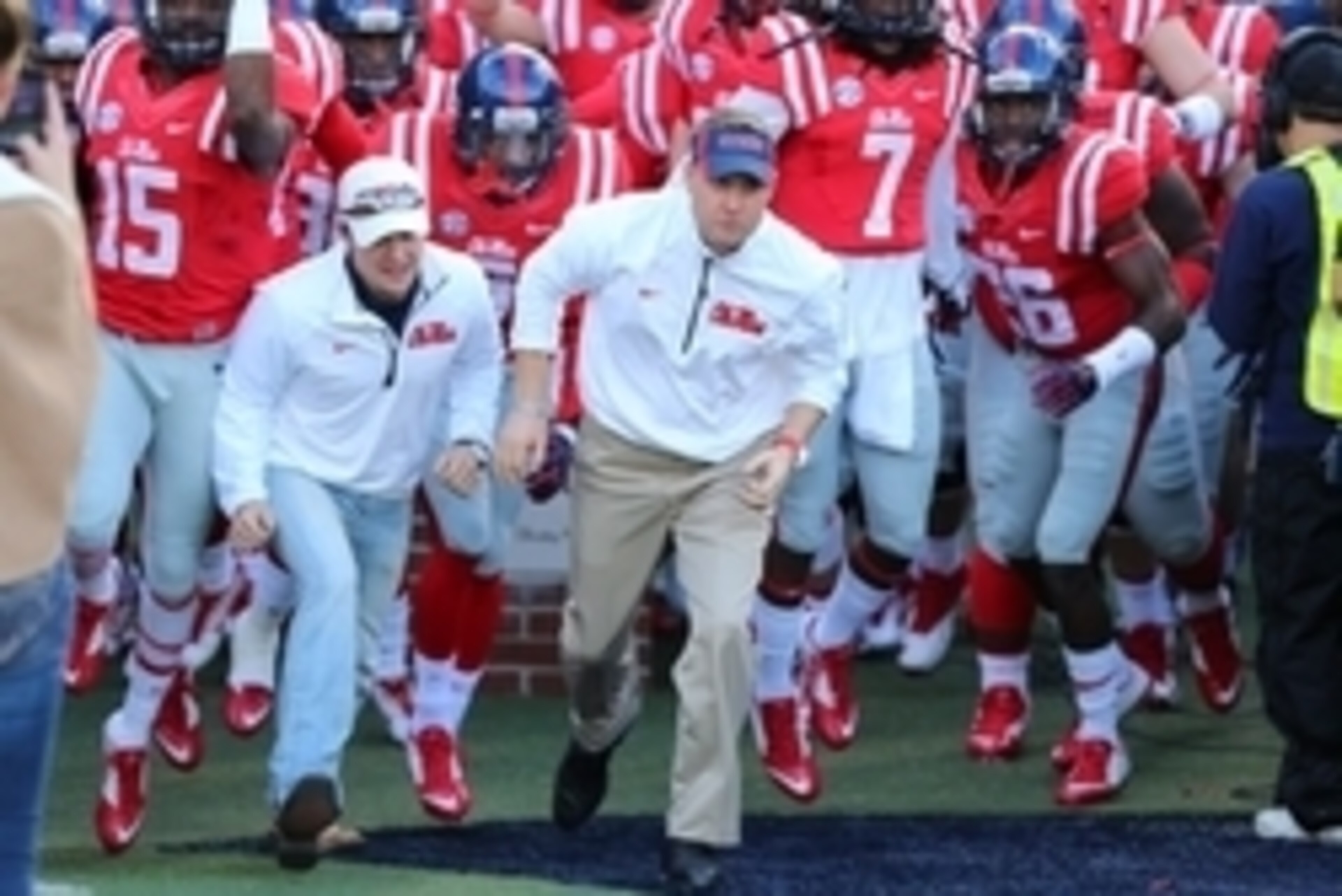 Nov 29, 2014; Oxford, MS, USA; Mississippi Rebels head coach Hugh Freeze leads the Mississippi Rebels onto the field before the game against the Mississippi State Bulldogs at Vaught-Hemingway Stadium. Mandatory Credit: Spruce Derden-USA TODAY Sports