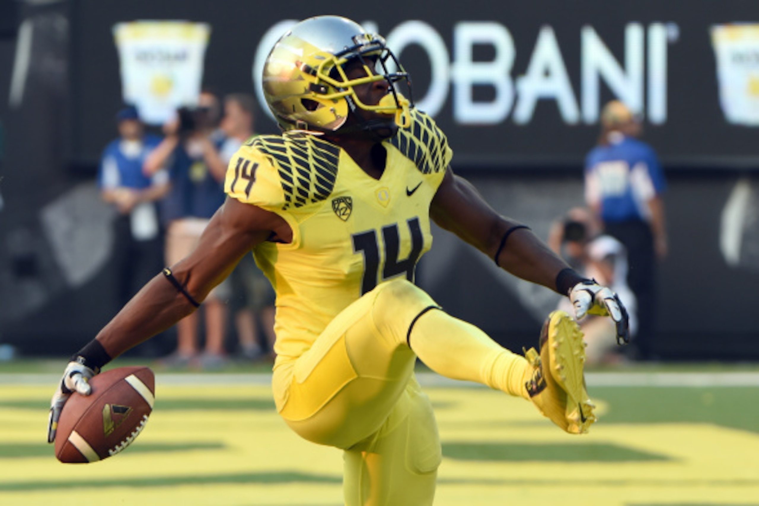 EUGENE, OR -SEPTEMBER 06: Defensive back Ifo Ekpre-Olomu #14 of the Oregon Ducks celebrates after intercepting a pass during the fourth quarter of the game against the Michigan State Spartans at Autzen Stadium on September 6, 2014 in Eugene, Oregon. Orego